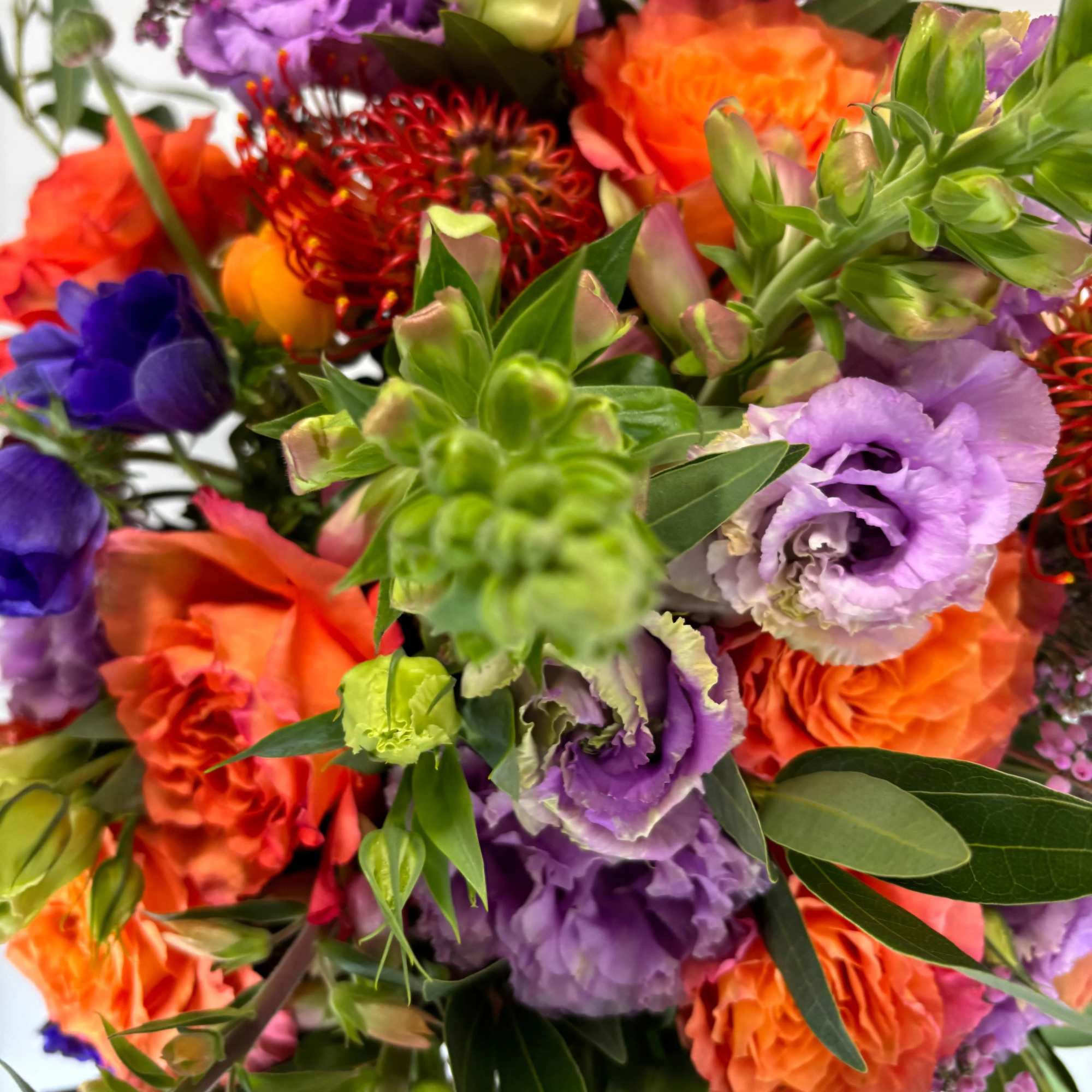 Colorful bouquet with orange, purple, and red flowers