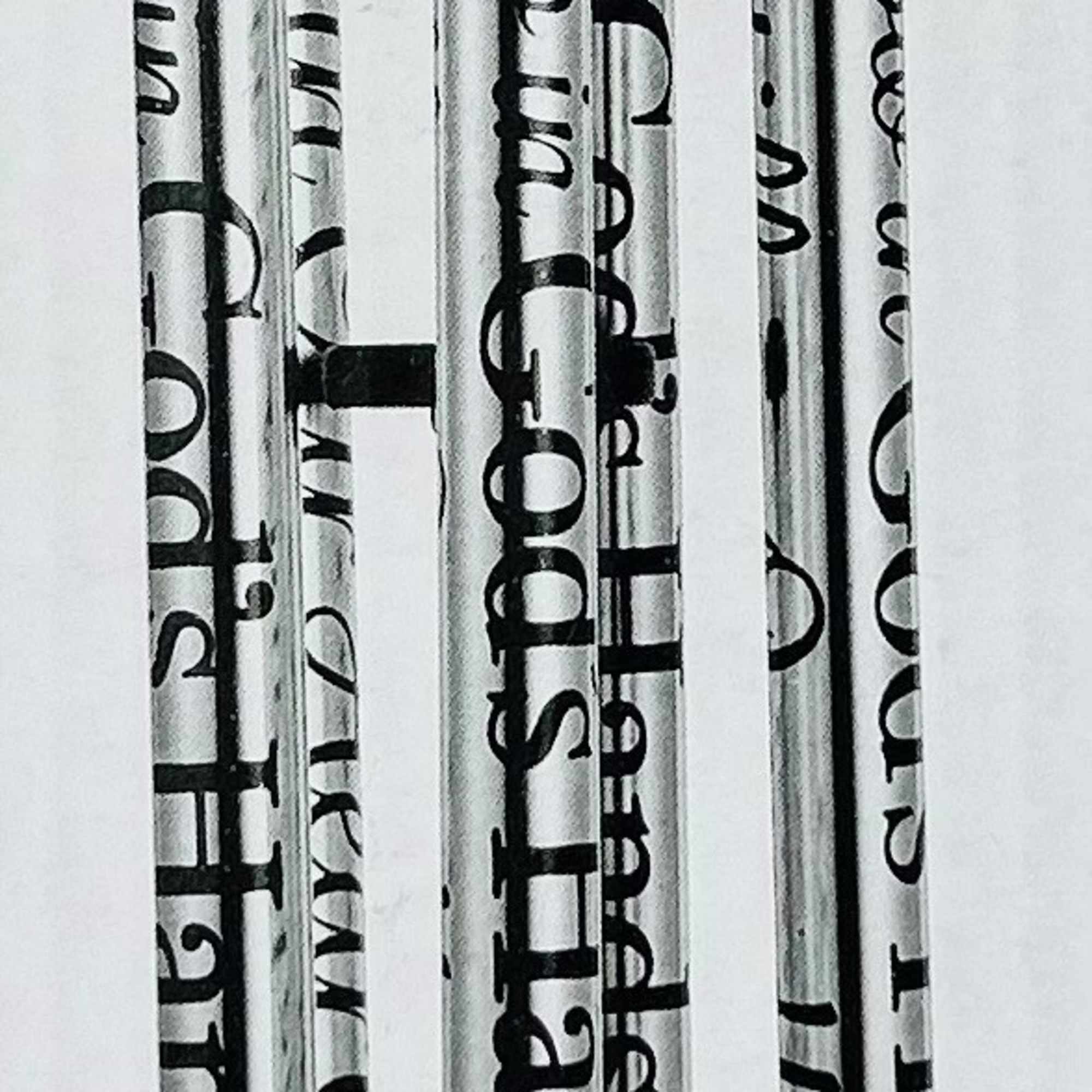 A solemn stainless steel wind chime engraved with "In God's Hands /