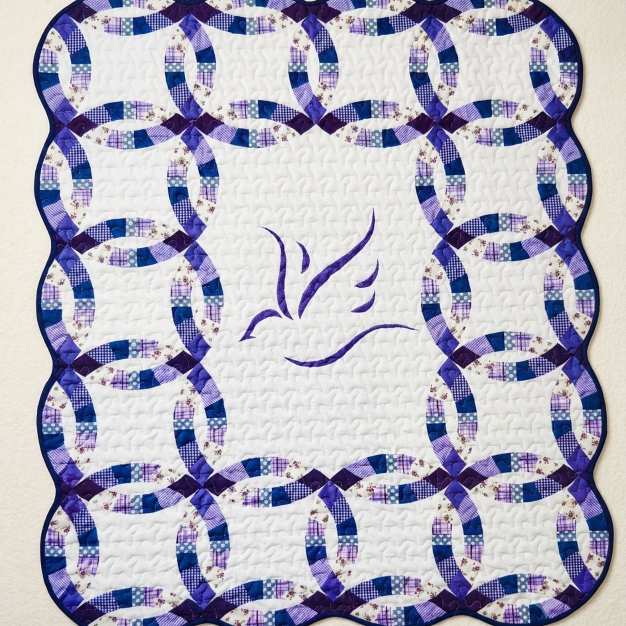 A cozy quilted throw patterned with interlocking peace ring motifs in shades
