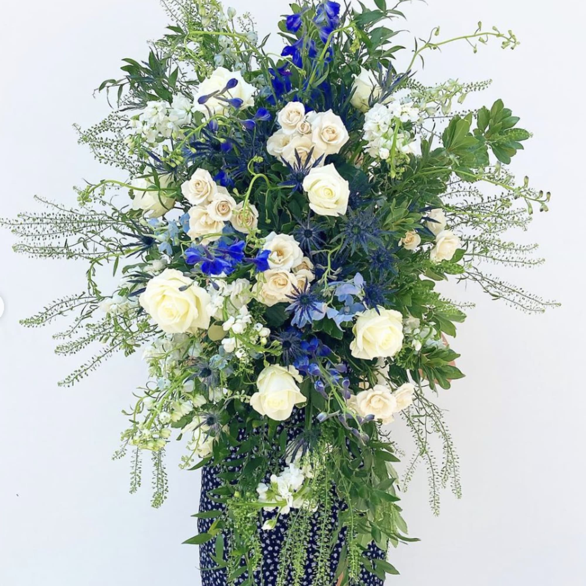 This oblong hanging floral spray adds a touch of elegance to celebrations