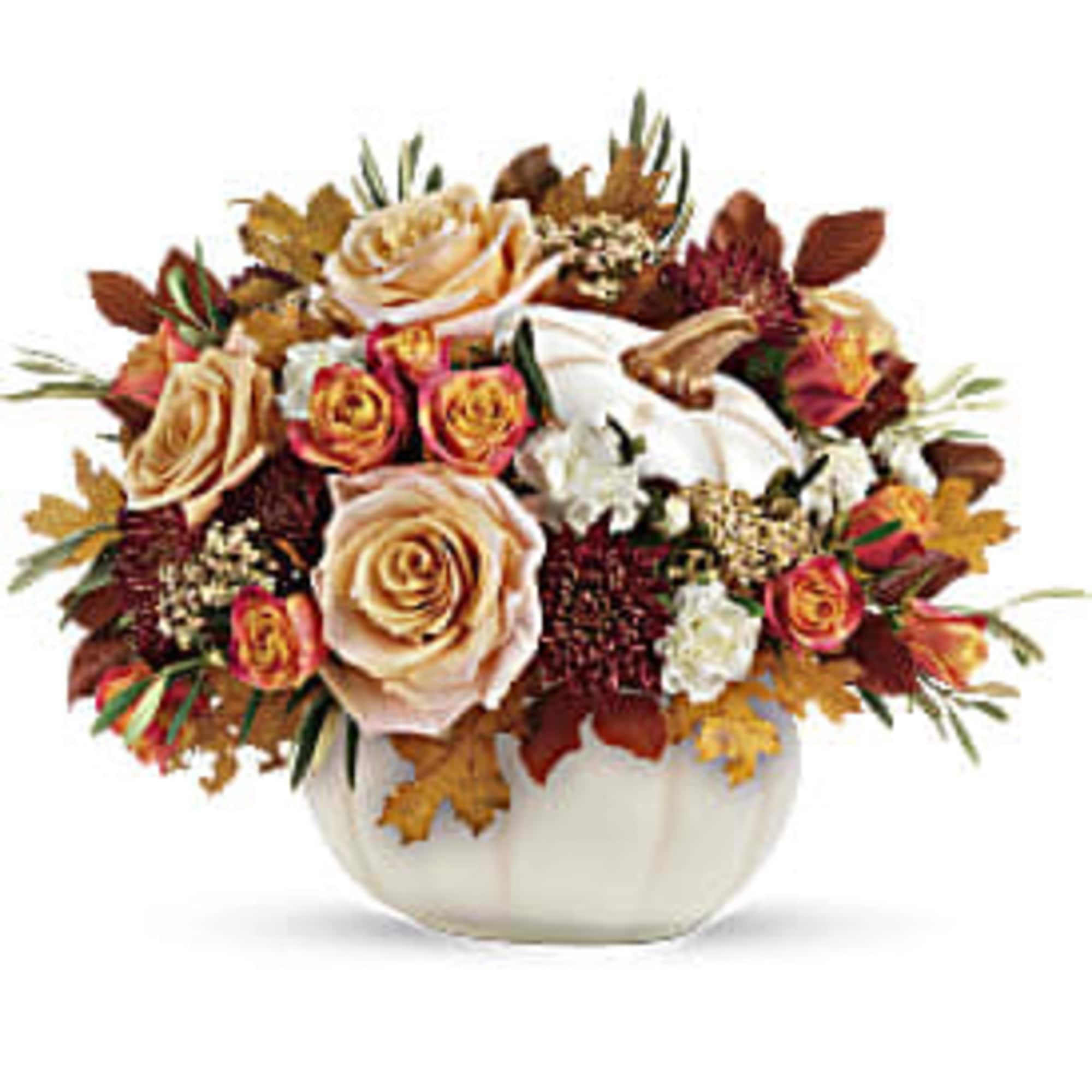 Autumn floral arrangement in a white pumpkin-shaped vase with roses