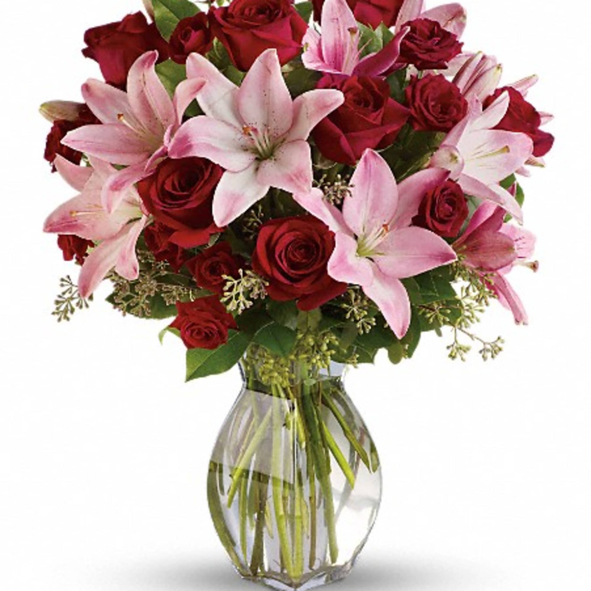 Bouquet of red roses and pink lilies in a clear glass vase, photo 2 of 3
