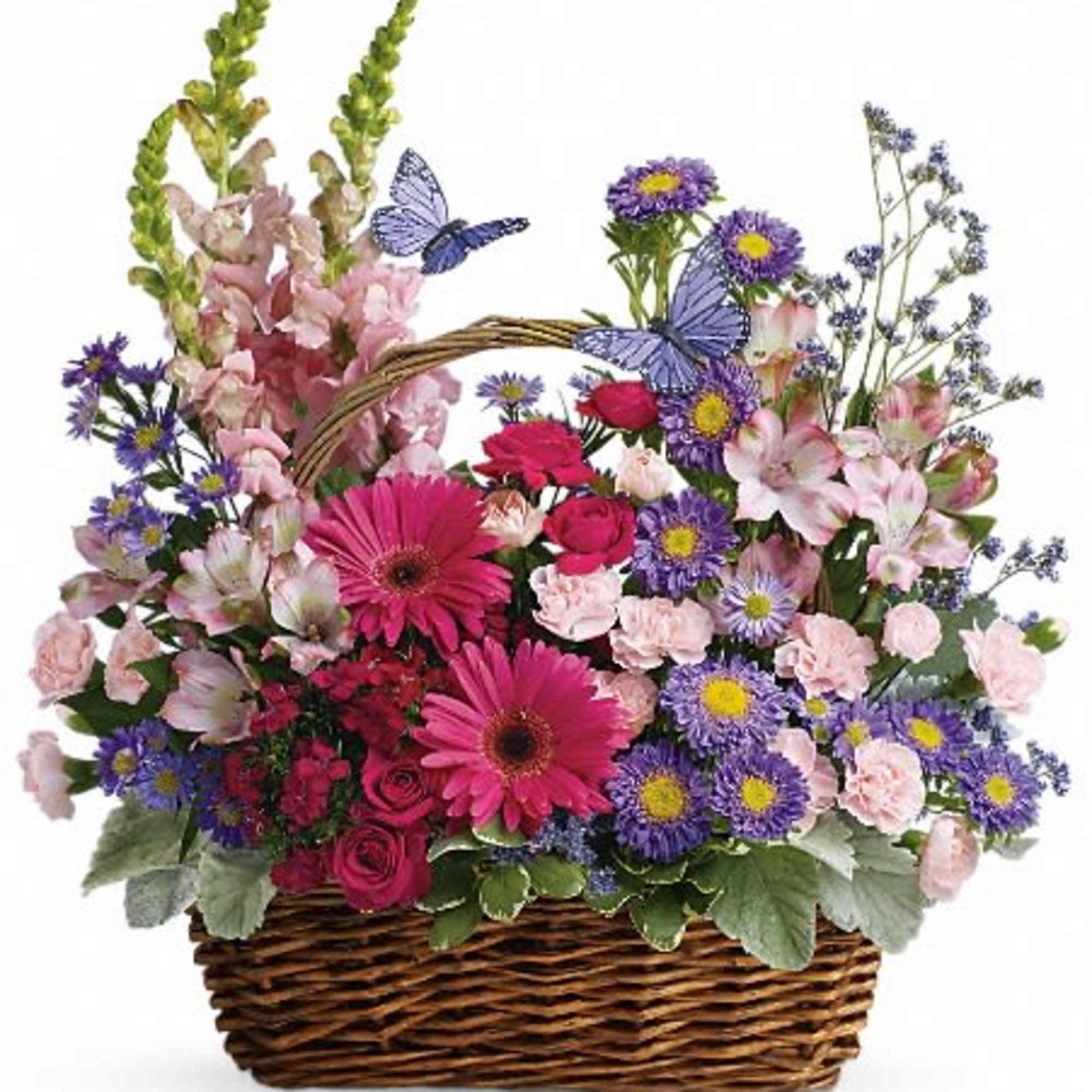Basket arrangement of pink, purple, and red flowers with butterfly picks