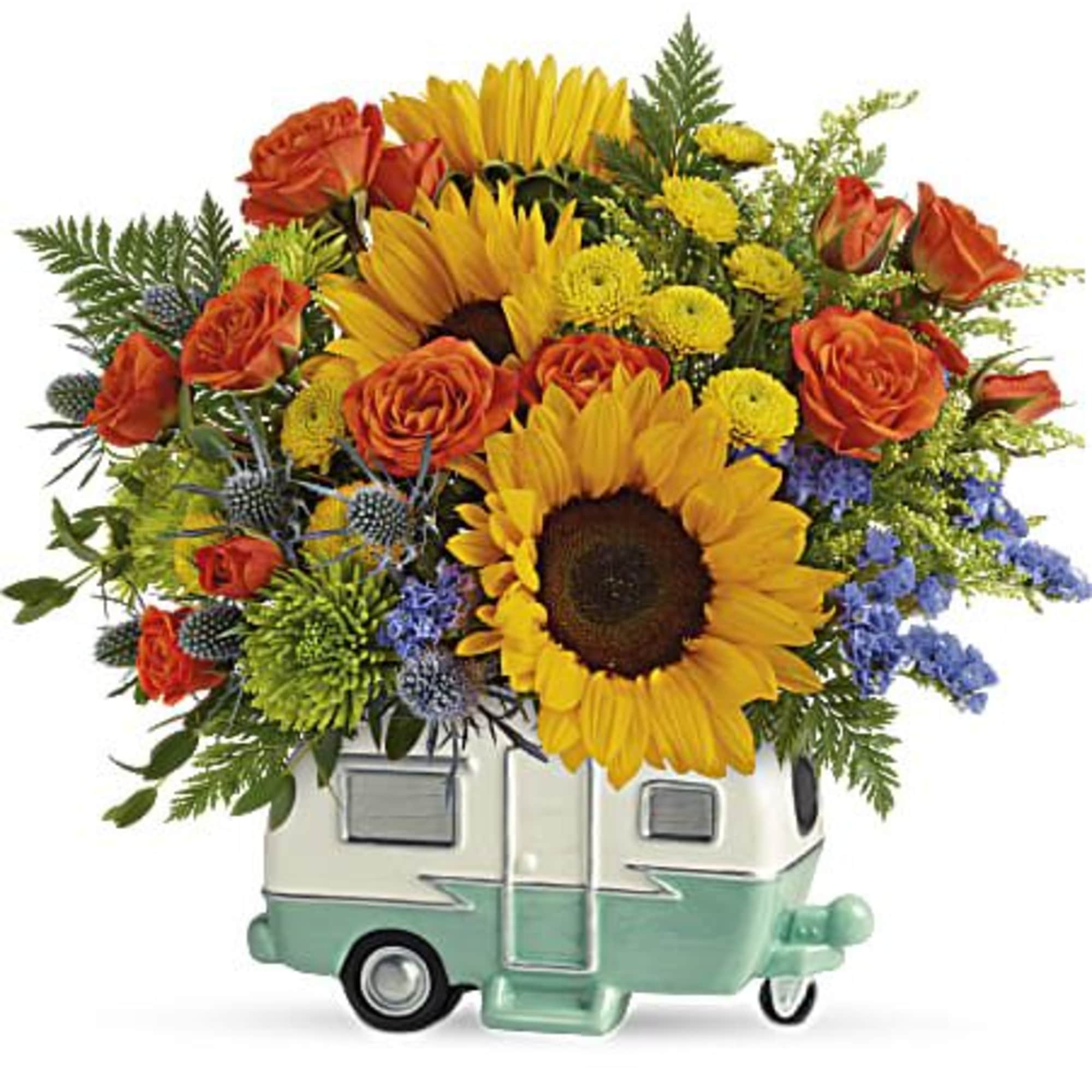 Bouquet of sunflowers and orange roses in a camper-shaped container