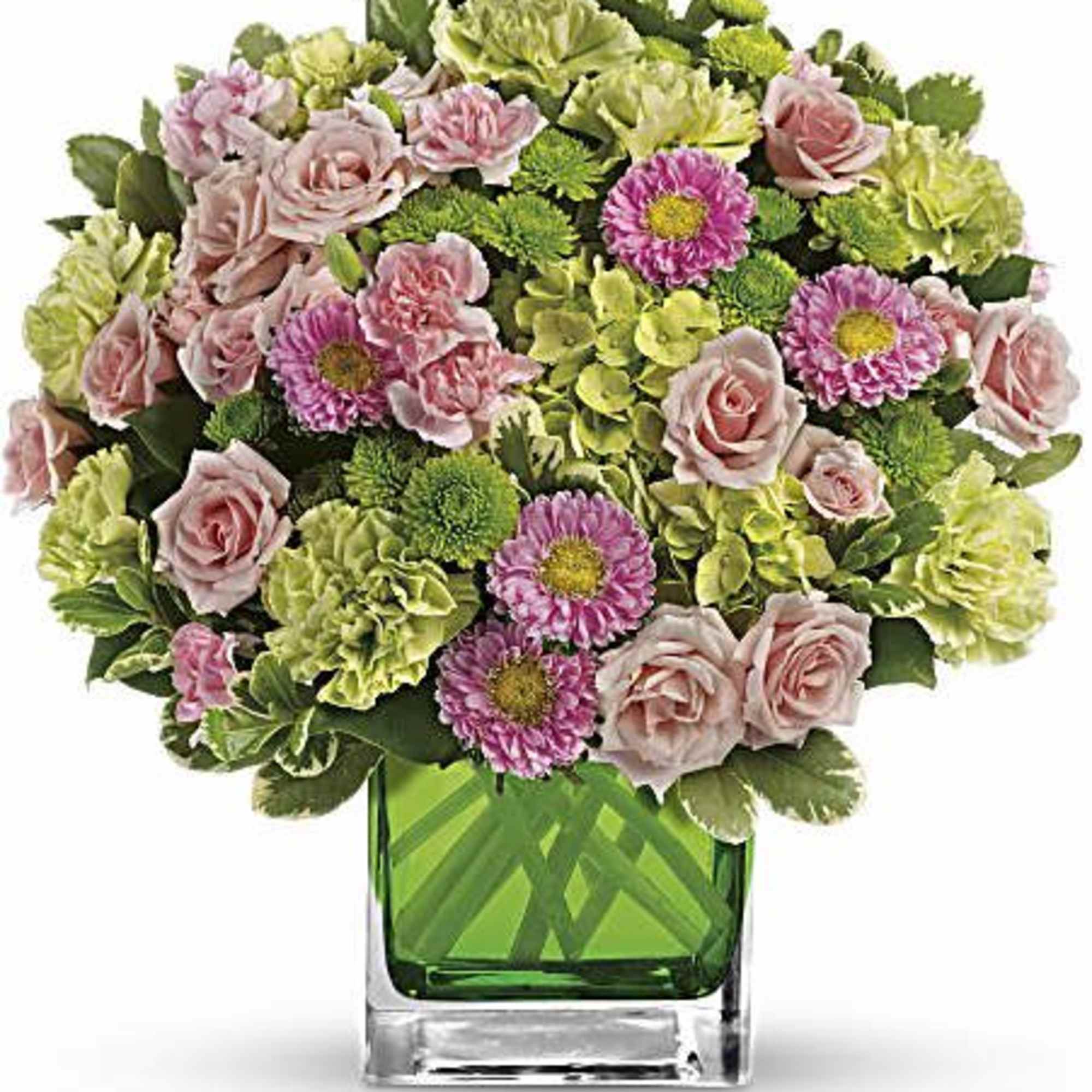Pink roses and green carnations in a square glass vase