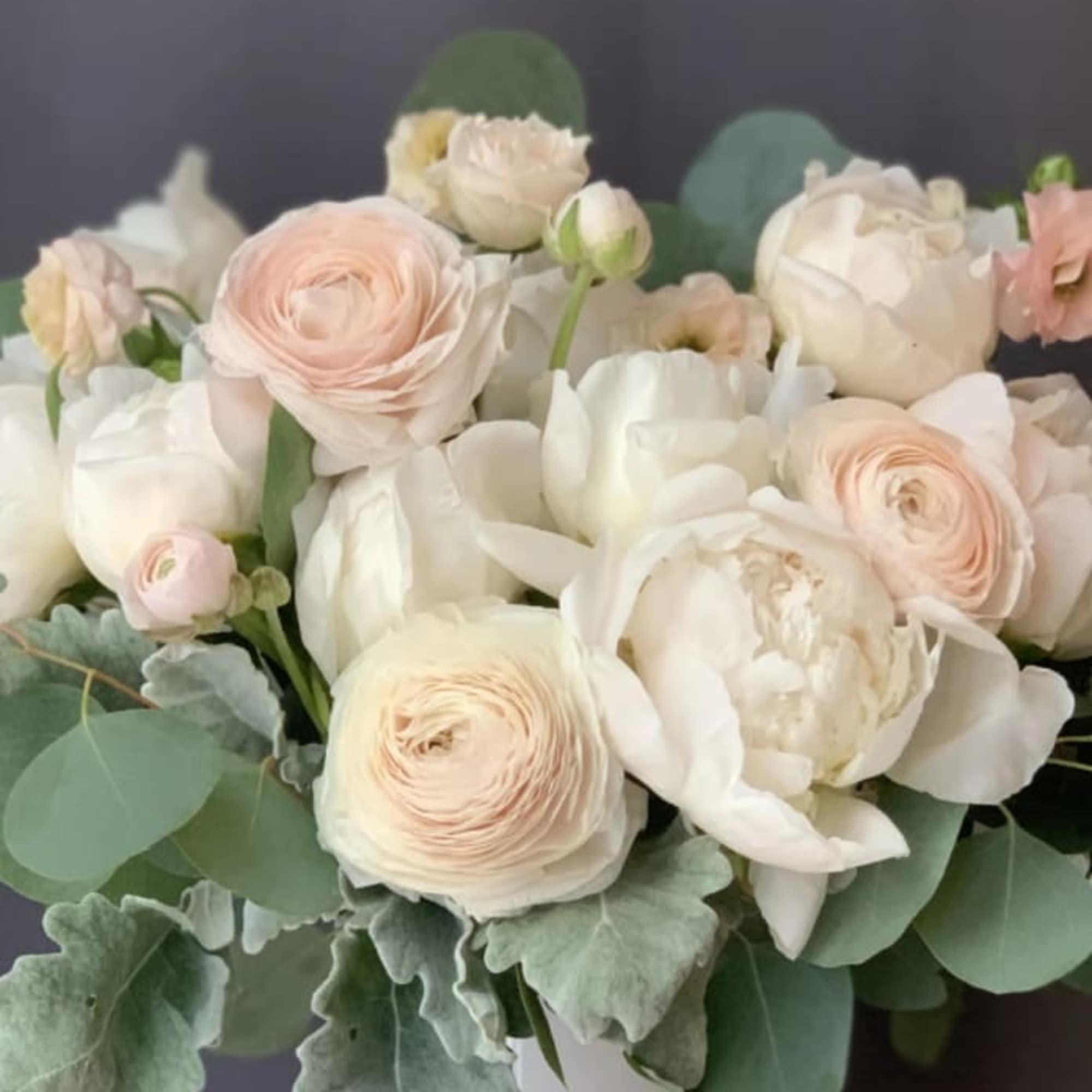 Bouquet of pale pink and white flowers with eucalyptus