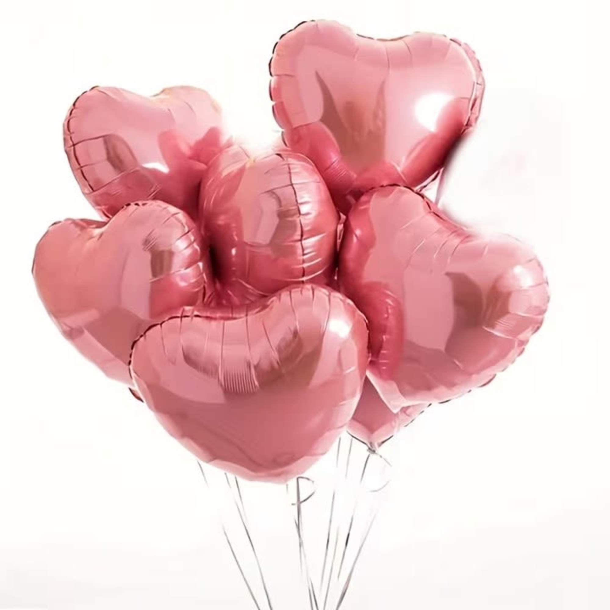 Cluster of pink heart-shaped balloons on strings