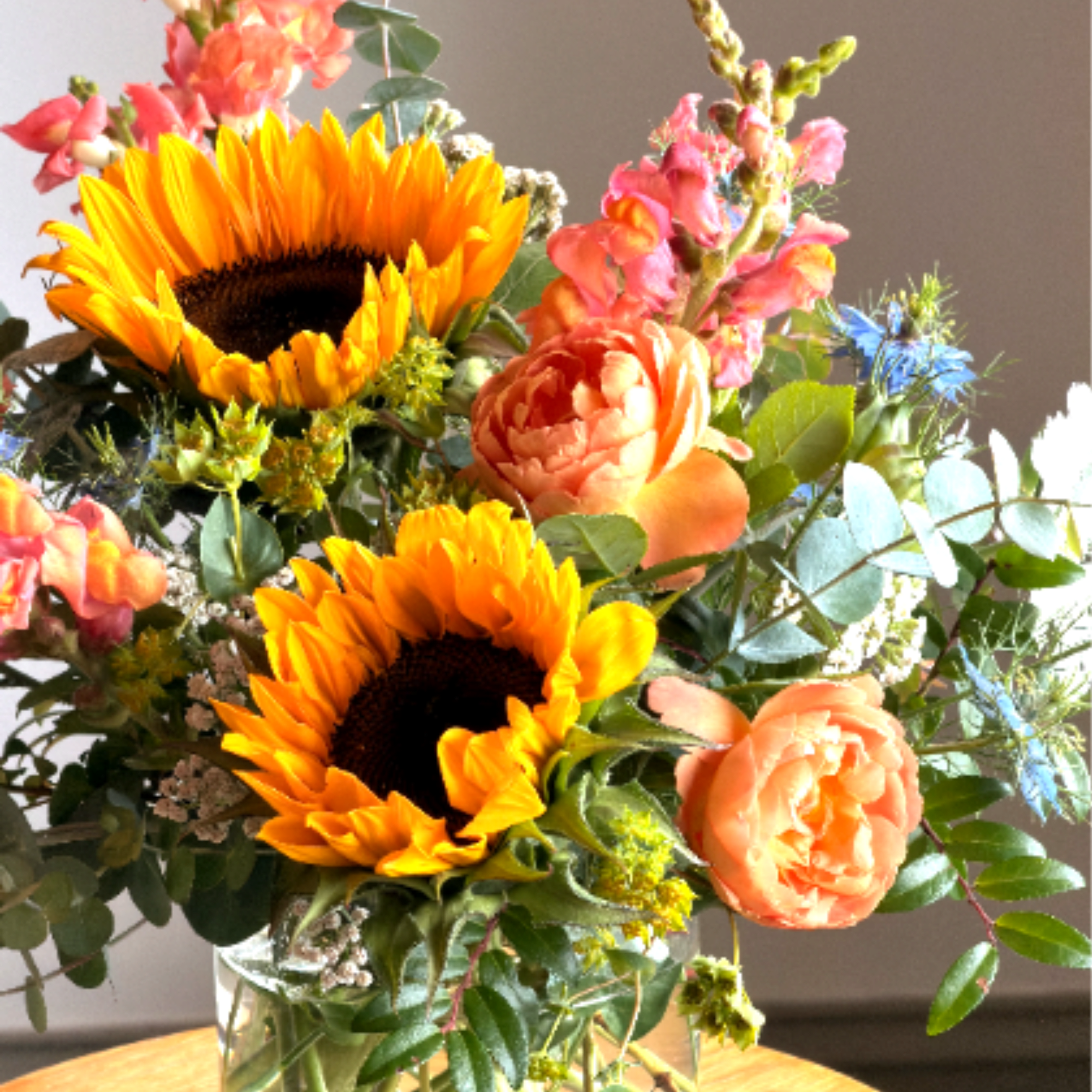 Brighten their day with bright summer blooms. This petite bouquet is arranged, photo 2 of 2