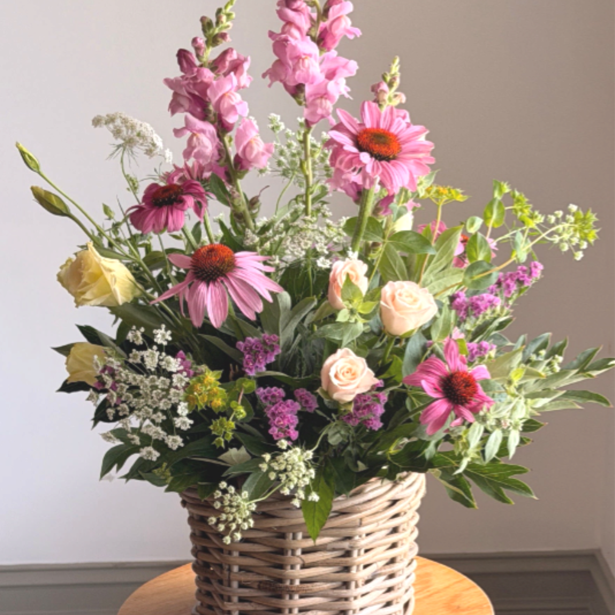 Share summer's bounty with this garden party bouquet. Tall snapdragons ride above