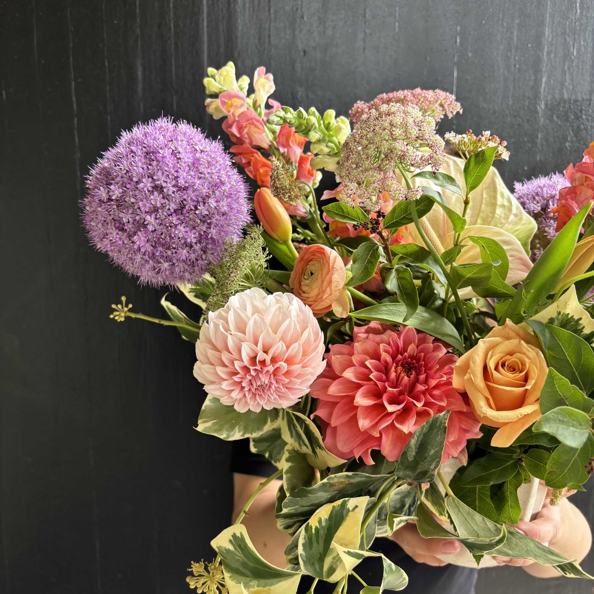 Mixed bouquet with purple allium, dahlias, roses, and snapdragons