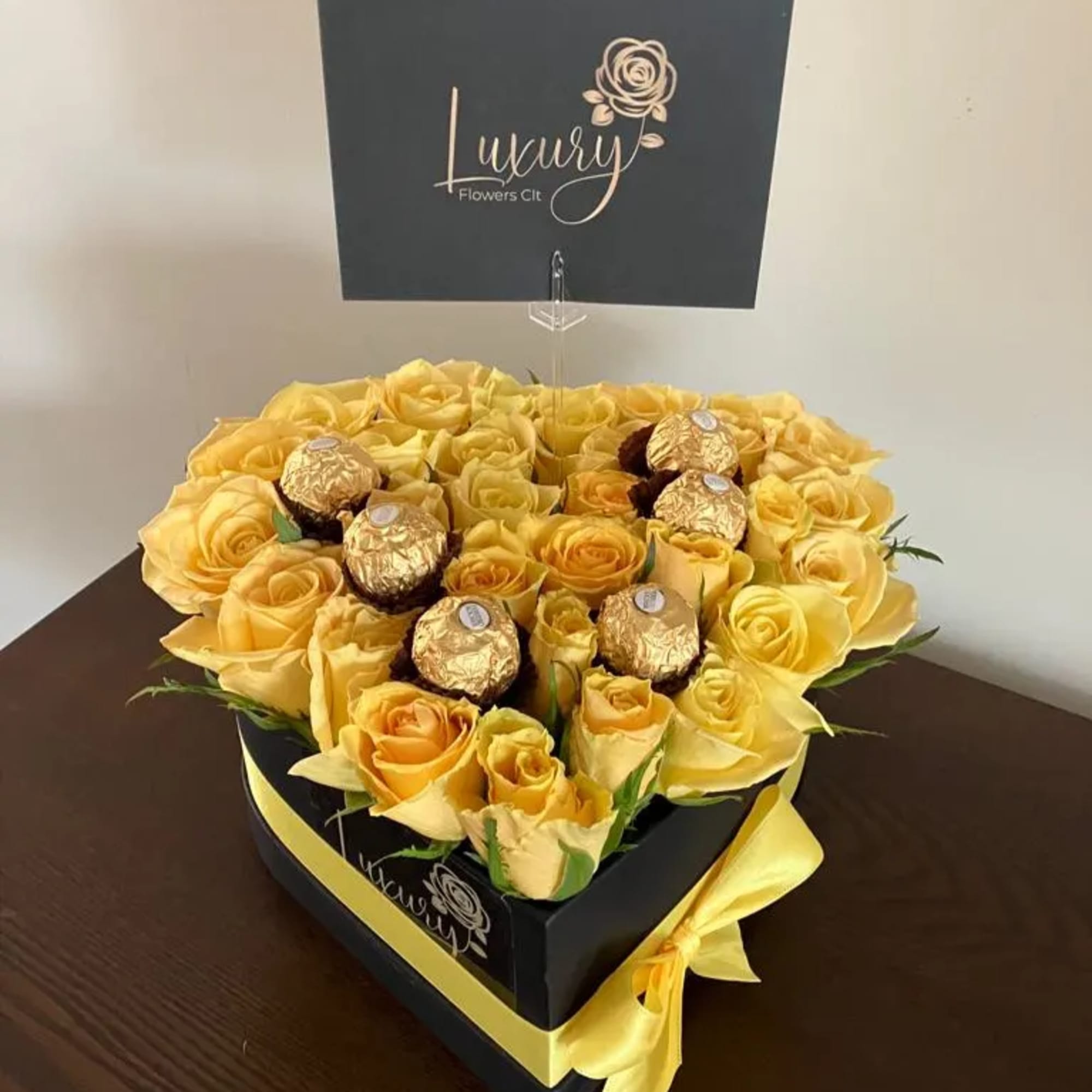 Candy Heart Box is an exclusive design of fresh roses and chocolates
