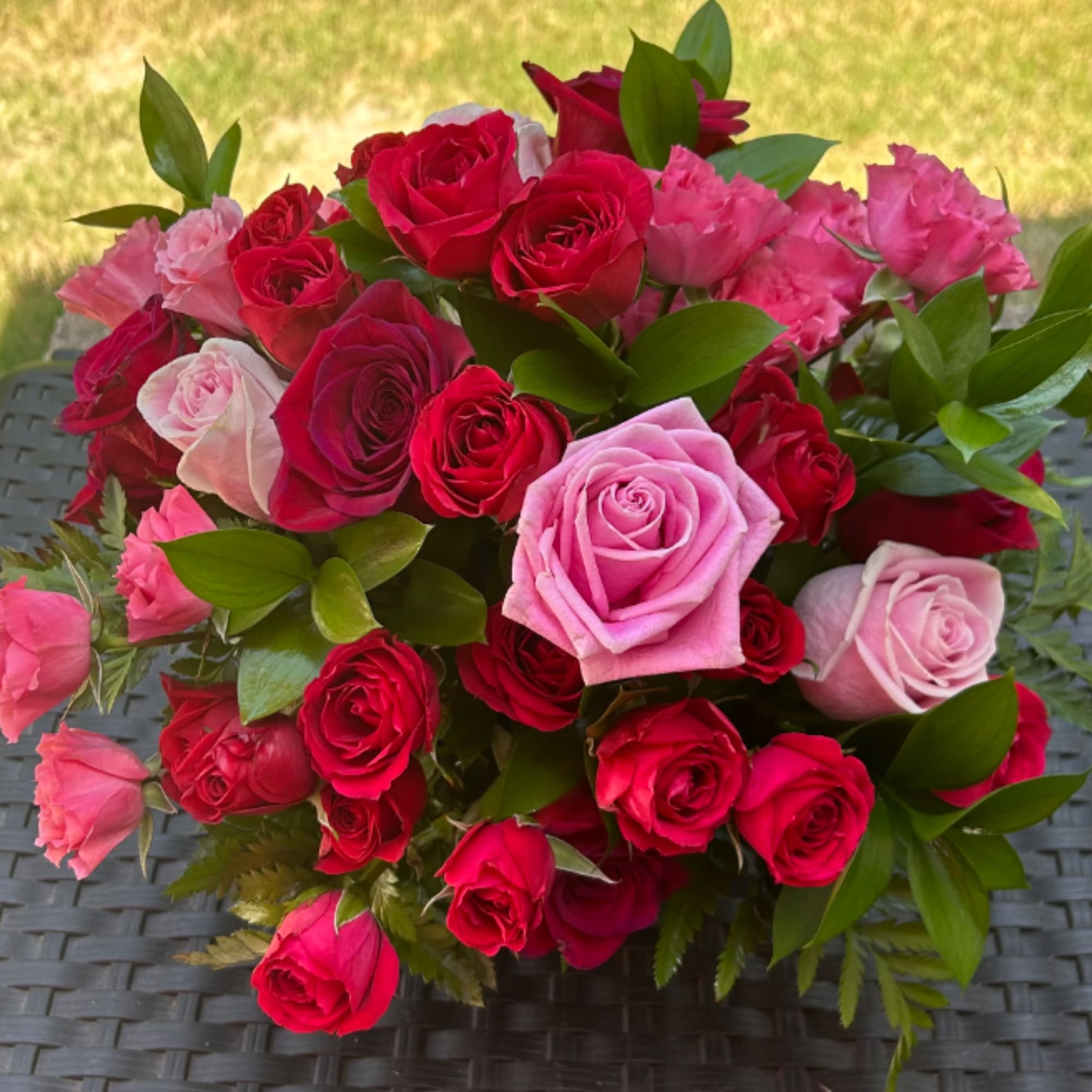This arrangement a true symbol of luxury.

Bloom Details: Red &amp; Pink Roses, photo 2 of 3