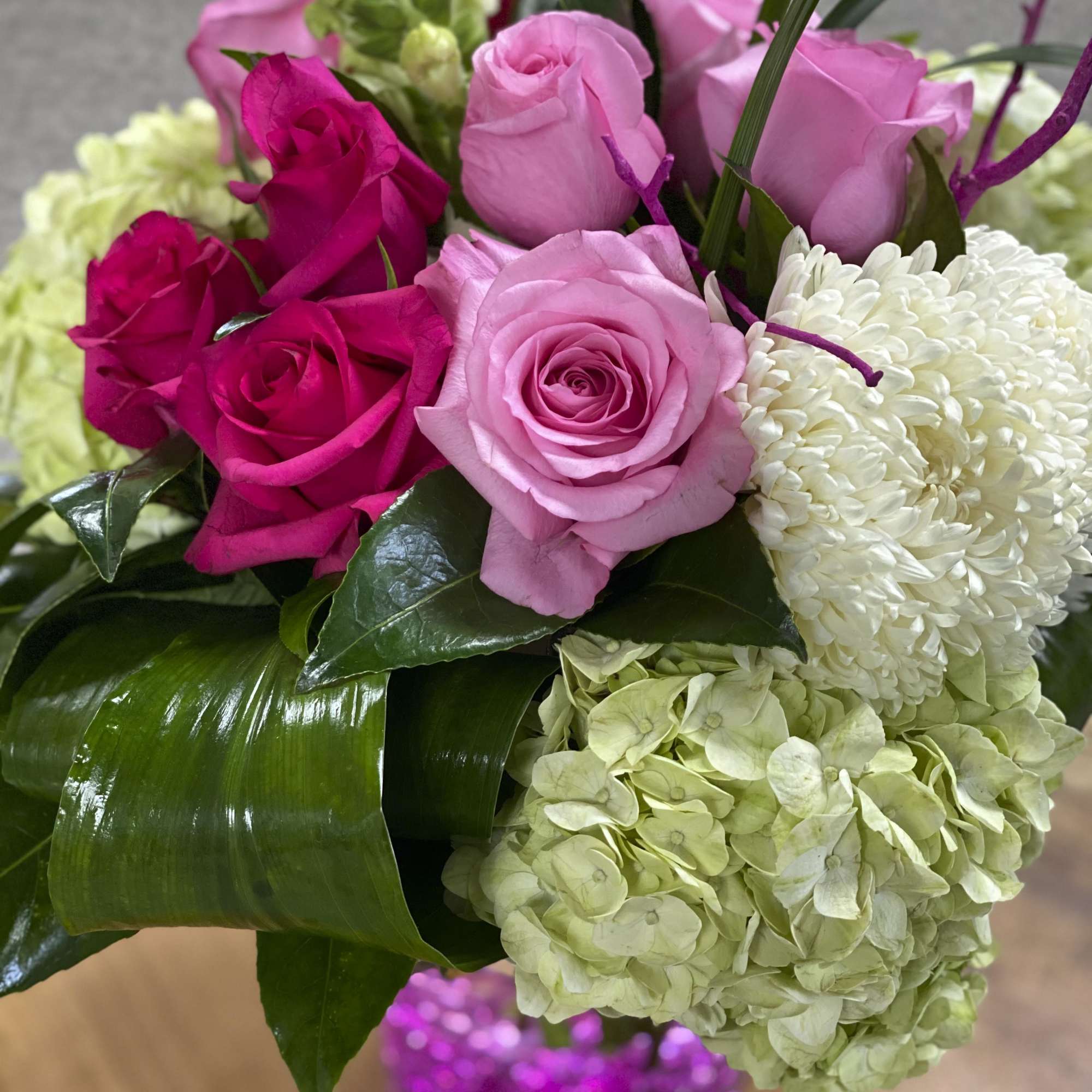 Bouquet of pink roses, white chrysanthemum, and pale green hydrangea