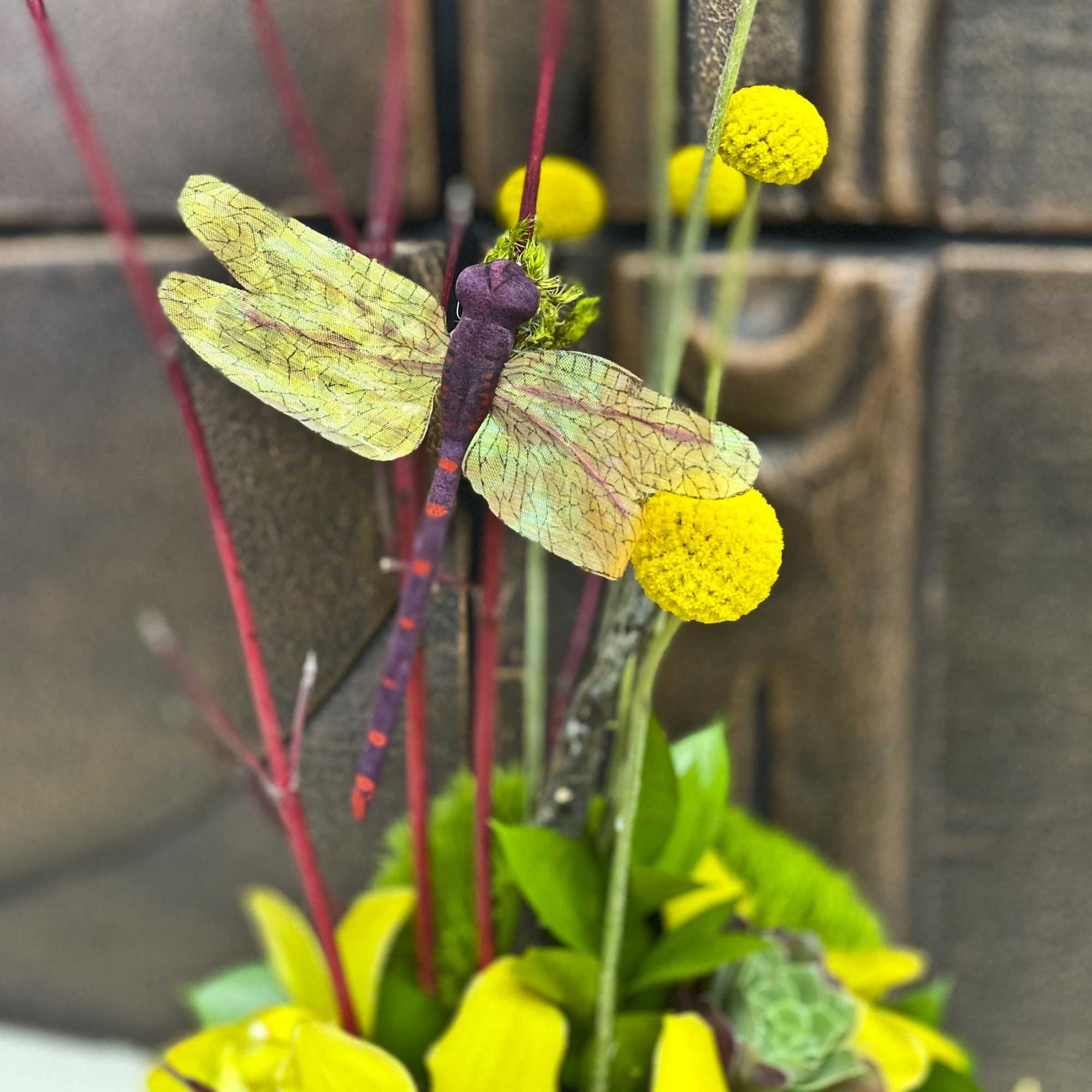 Decorative dragonfly ornament with yellow pom-pom flowers