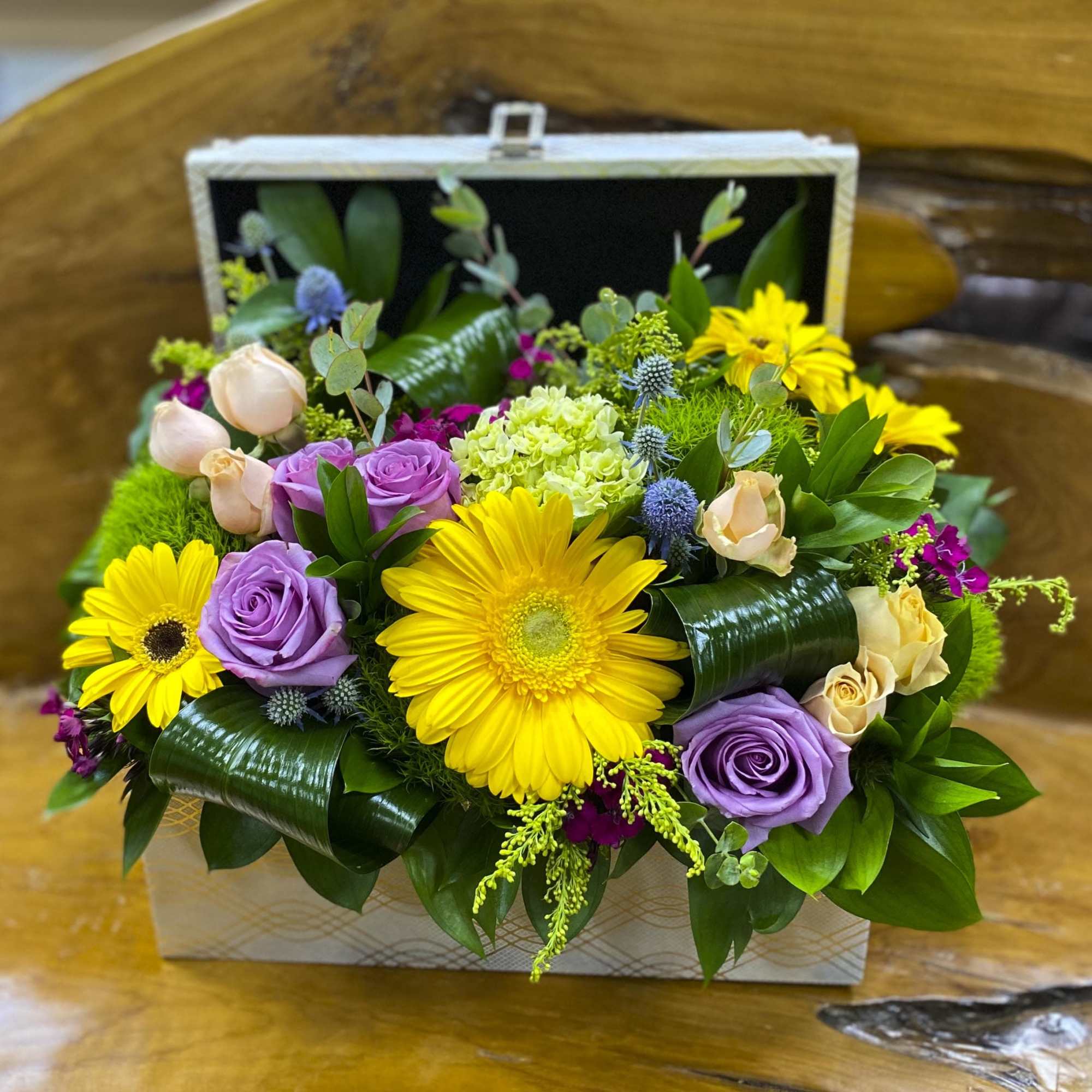 Mixed bouquet in a rectangular gift box with yellow daisies and purple roses