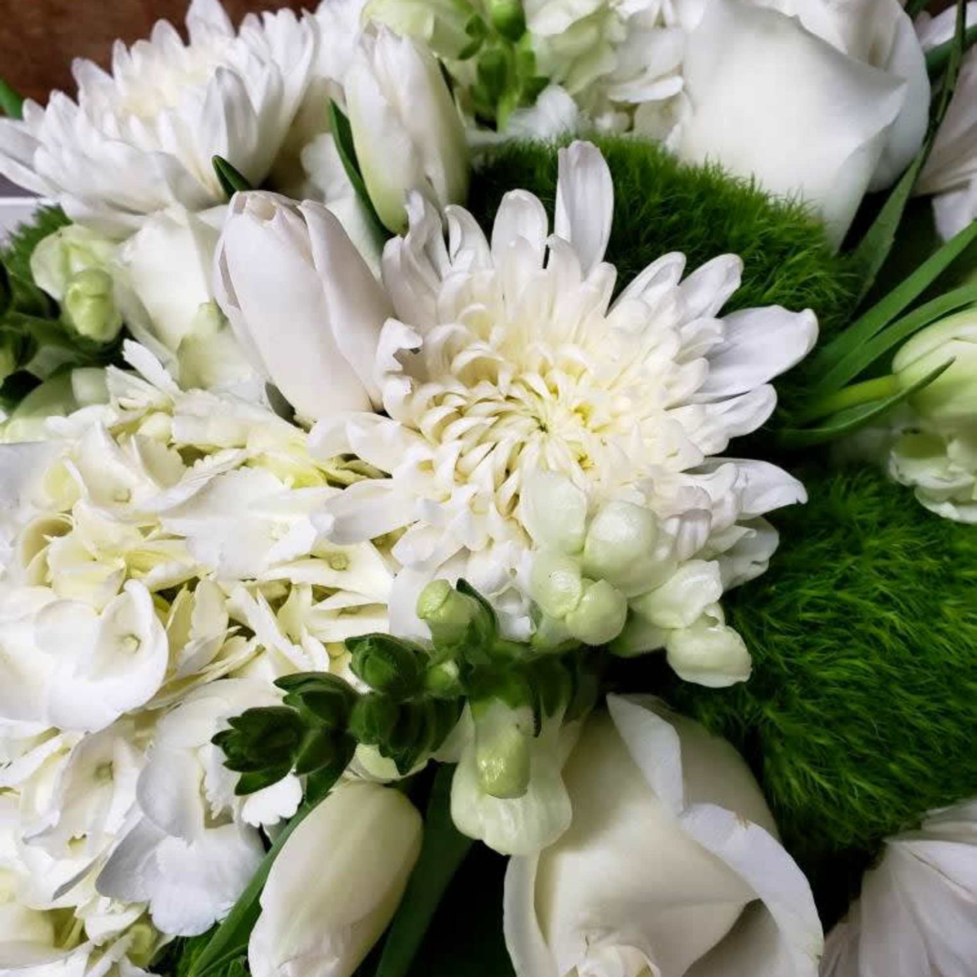 White bouquet with chrysanthemums, tulips, and calla lilies