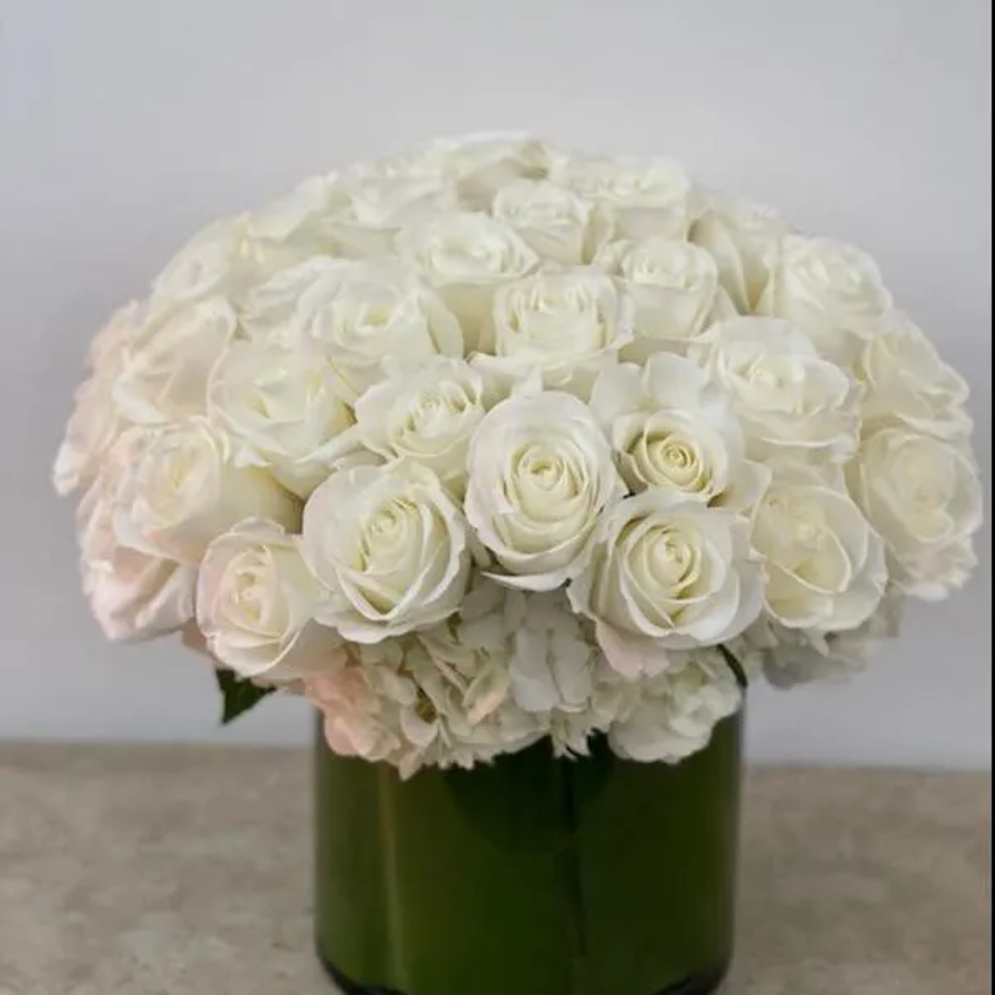 White rose bouquet in a green glass vase, photo 5 of 5