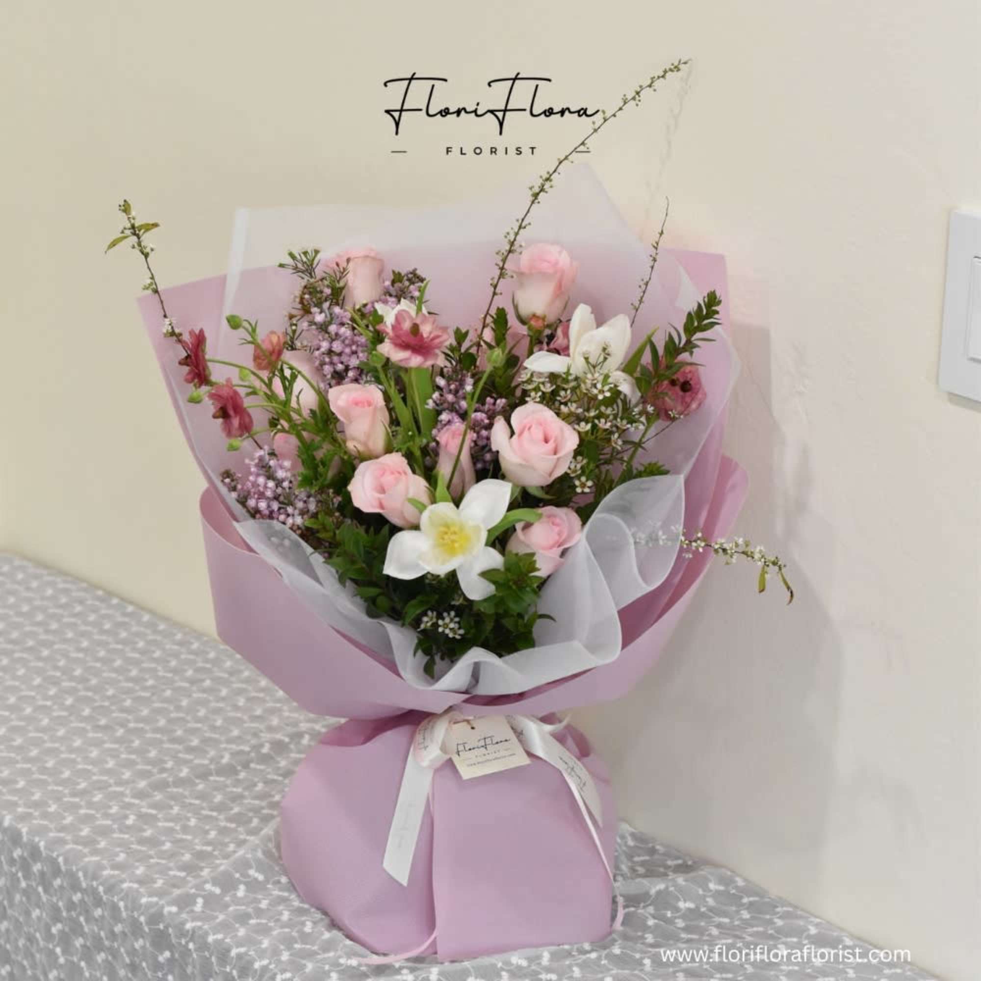 Behind the Clouds is a lovely pink bouquet designed to brighten any