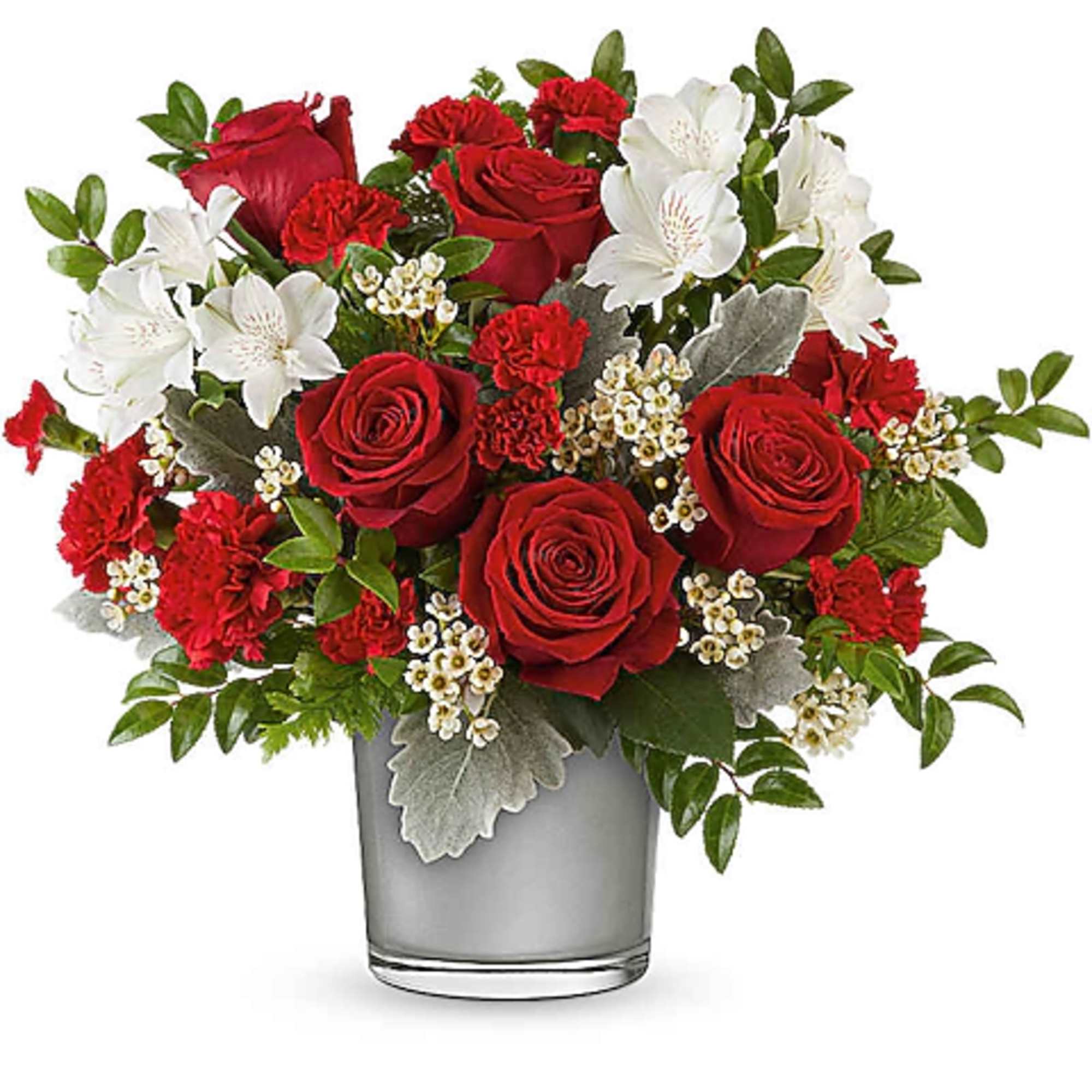Red roses and white flowers arranged in a clear glass vase