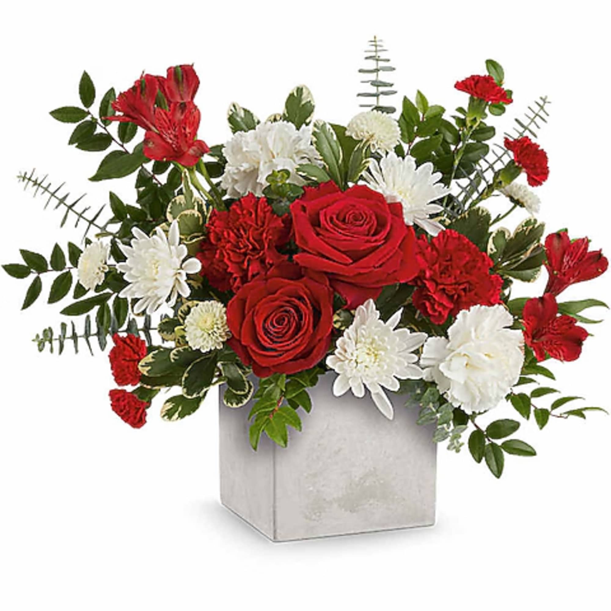 Red and white flower arrangement in a square silver vase