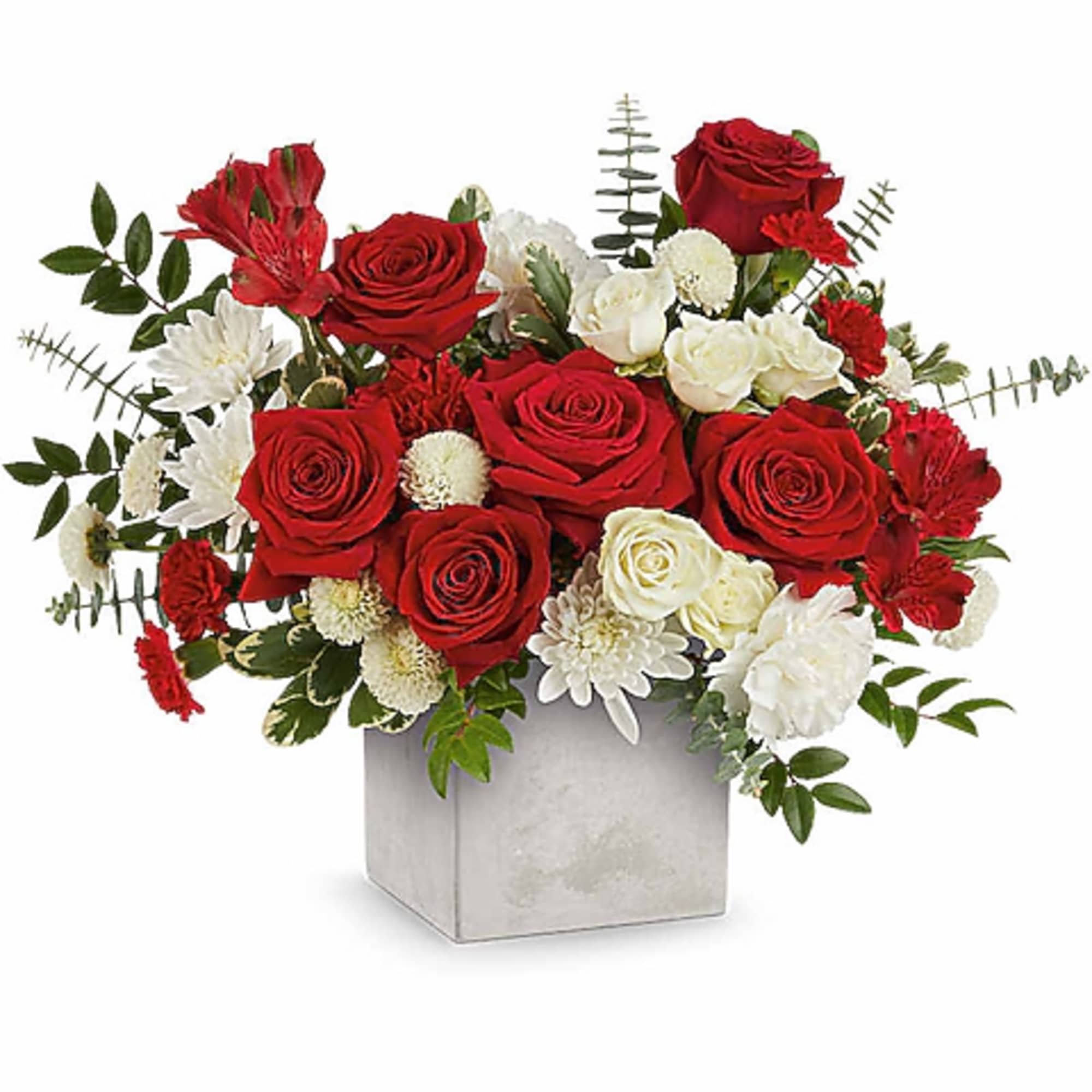 Red and white rose arrangement in a square silver vase