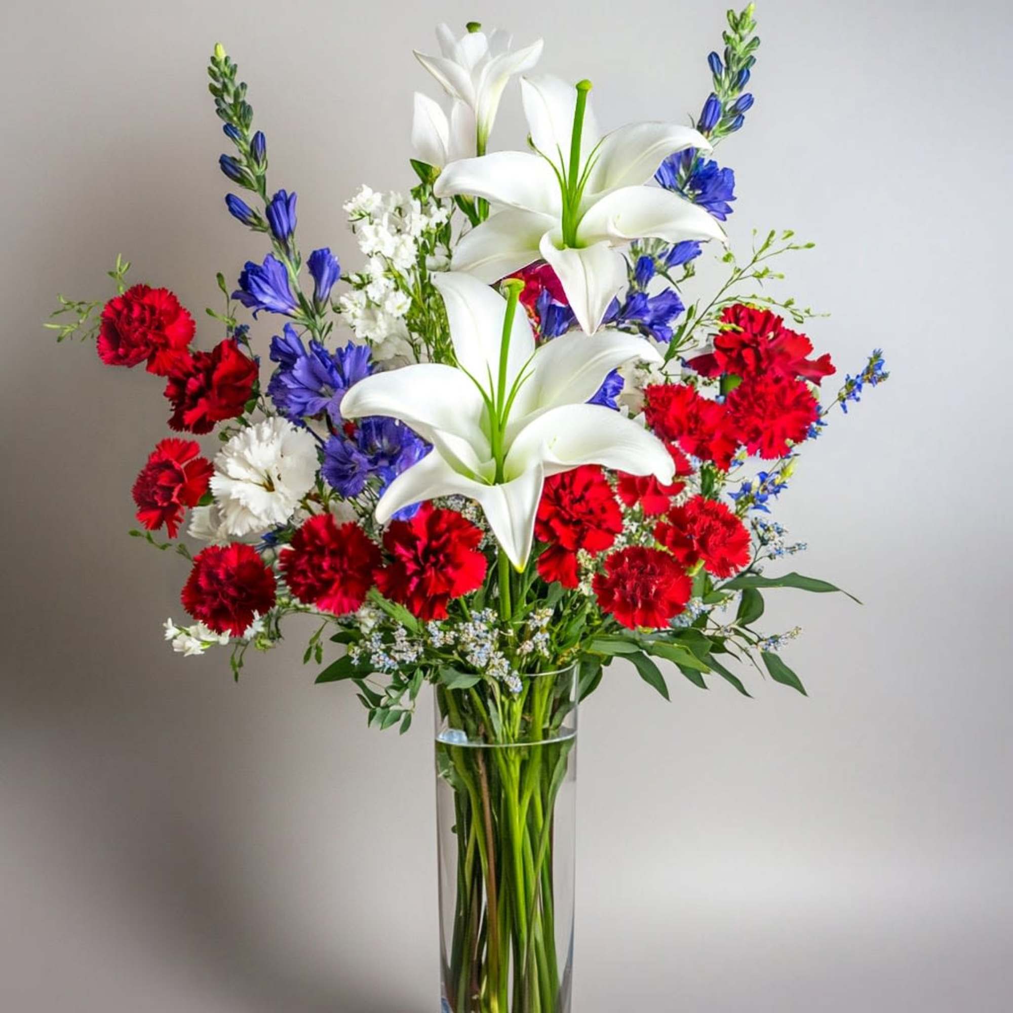 Classic and proud, this fresh arrangement brings the spirit of July 4th