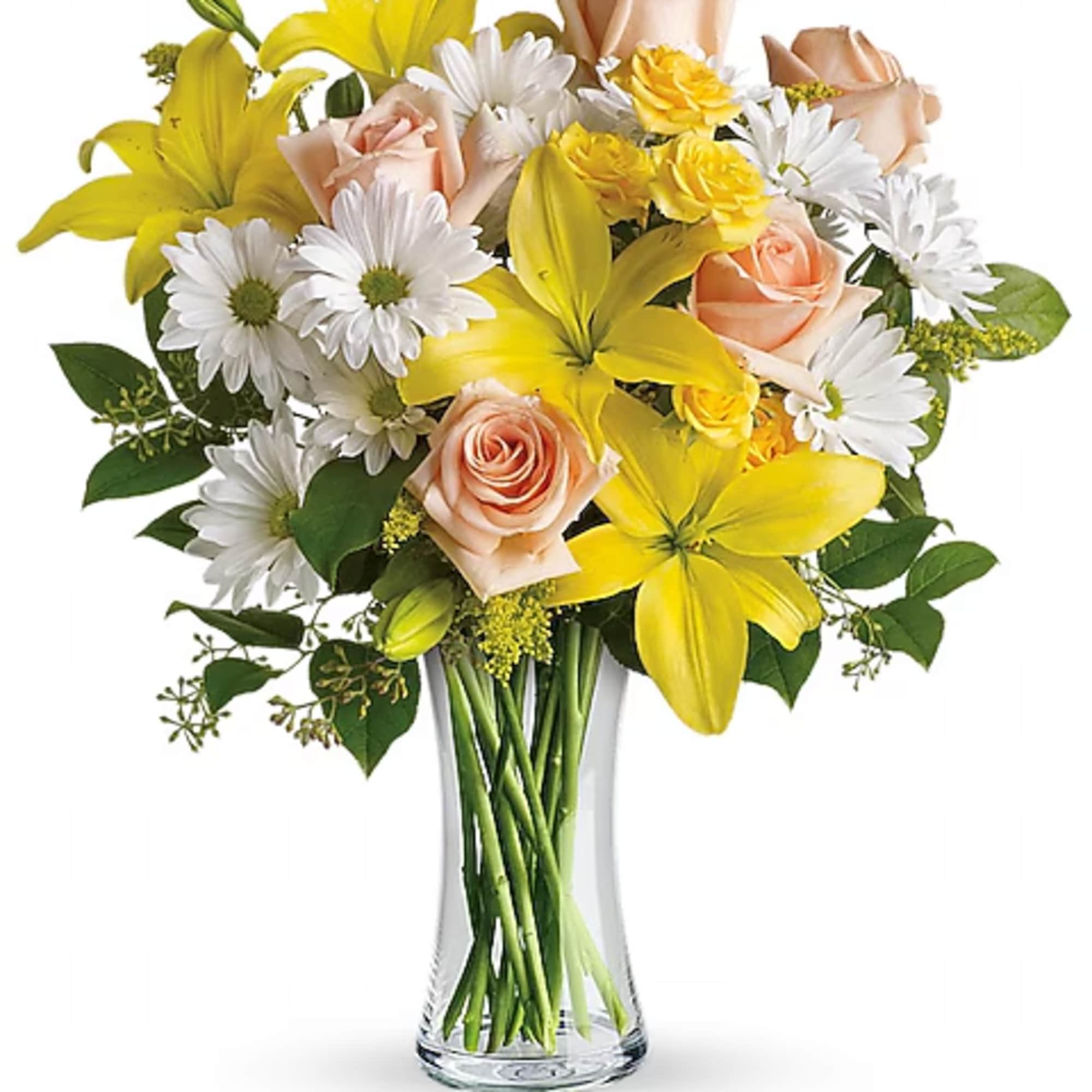 Bouquet of yellow lilies, peach roses, and white daisies in a clear glass vase
