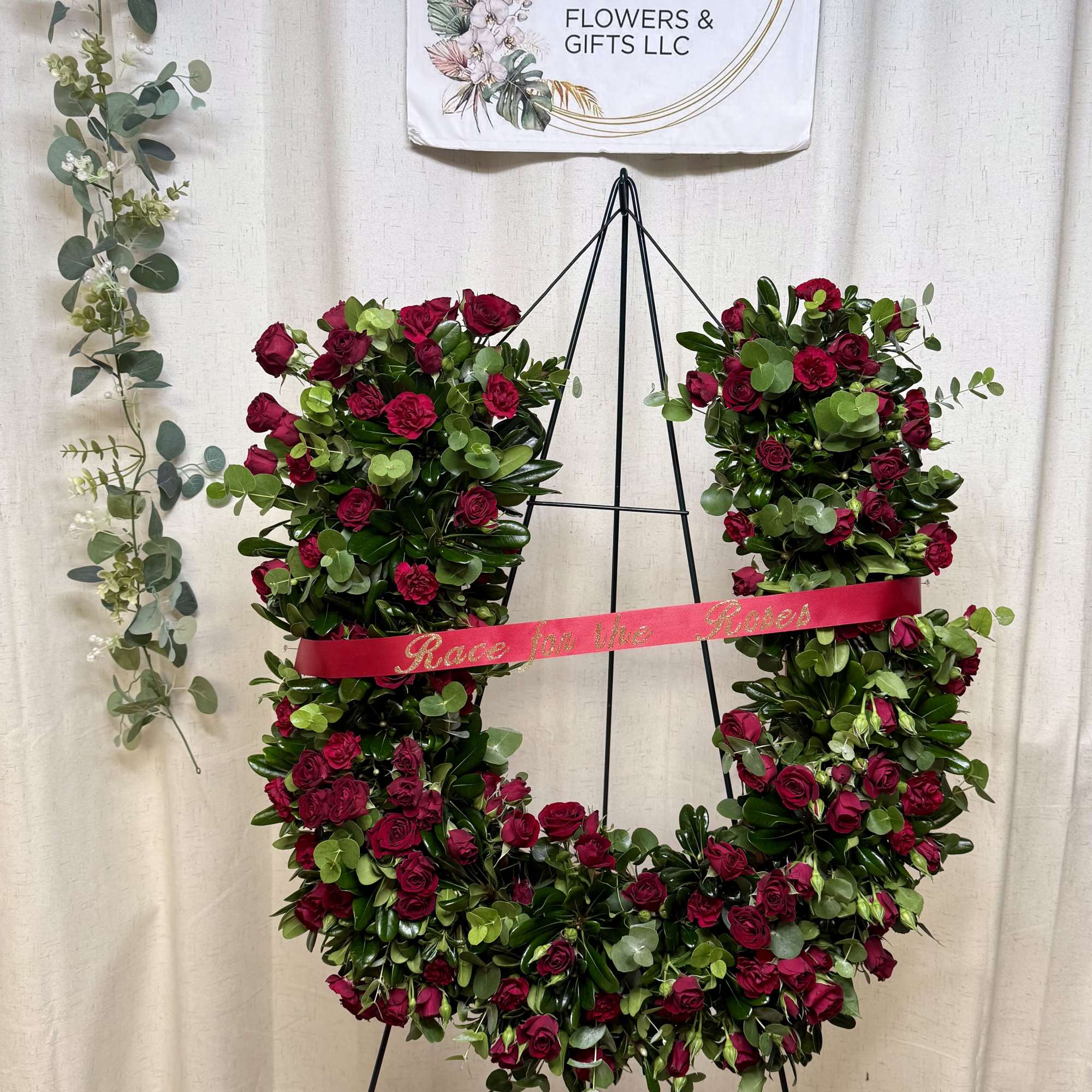 A beautiful and meaningful horseshoe-shaped floral tribute, designed to honor a loved