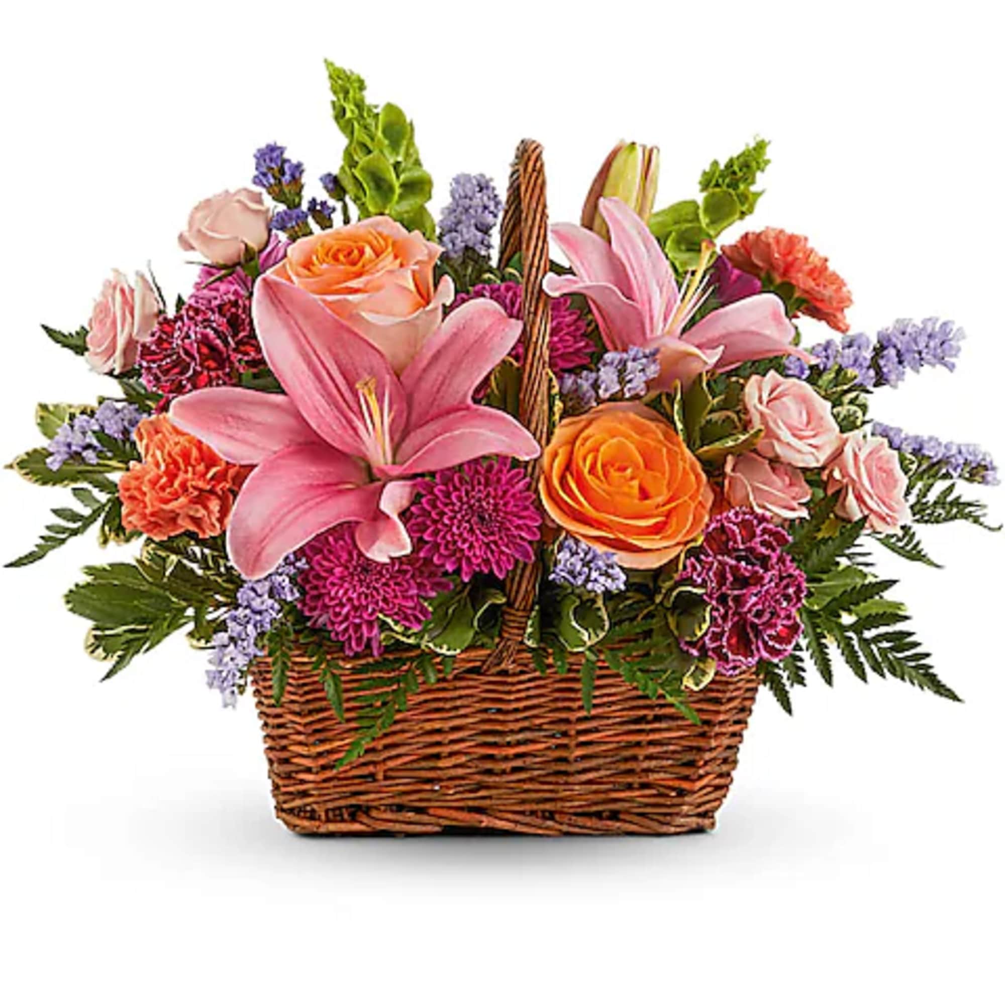 Mixed pink and orange flowers arranged in a wicker basket
