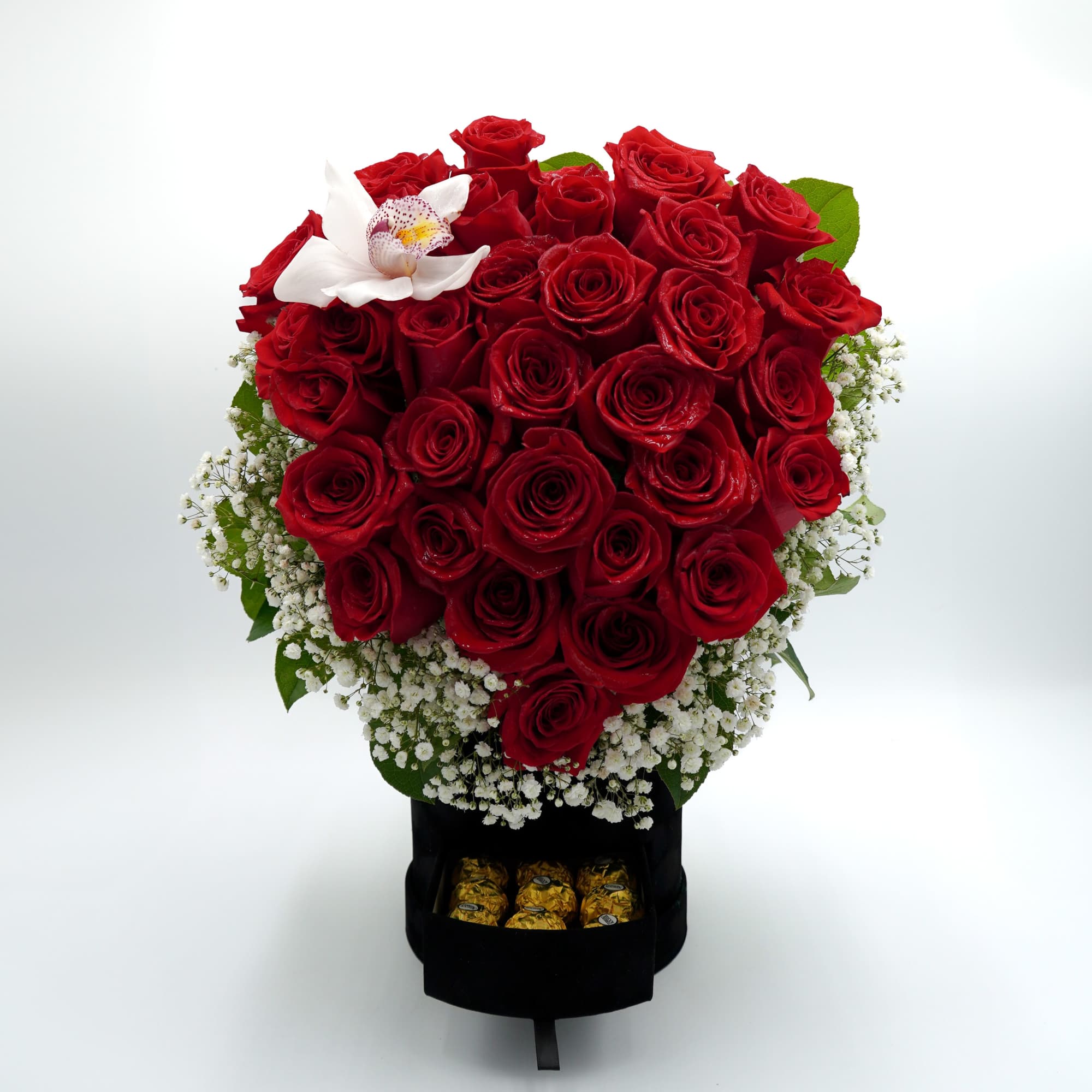 A dense cluster of red roses shaped into a rounded, full bouquet