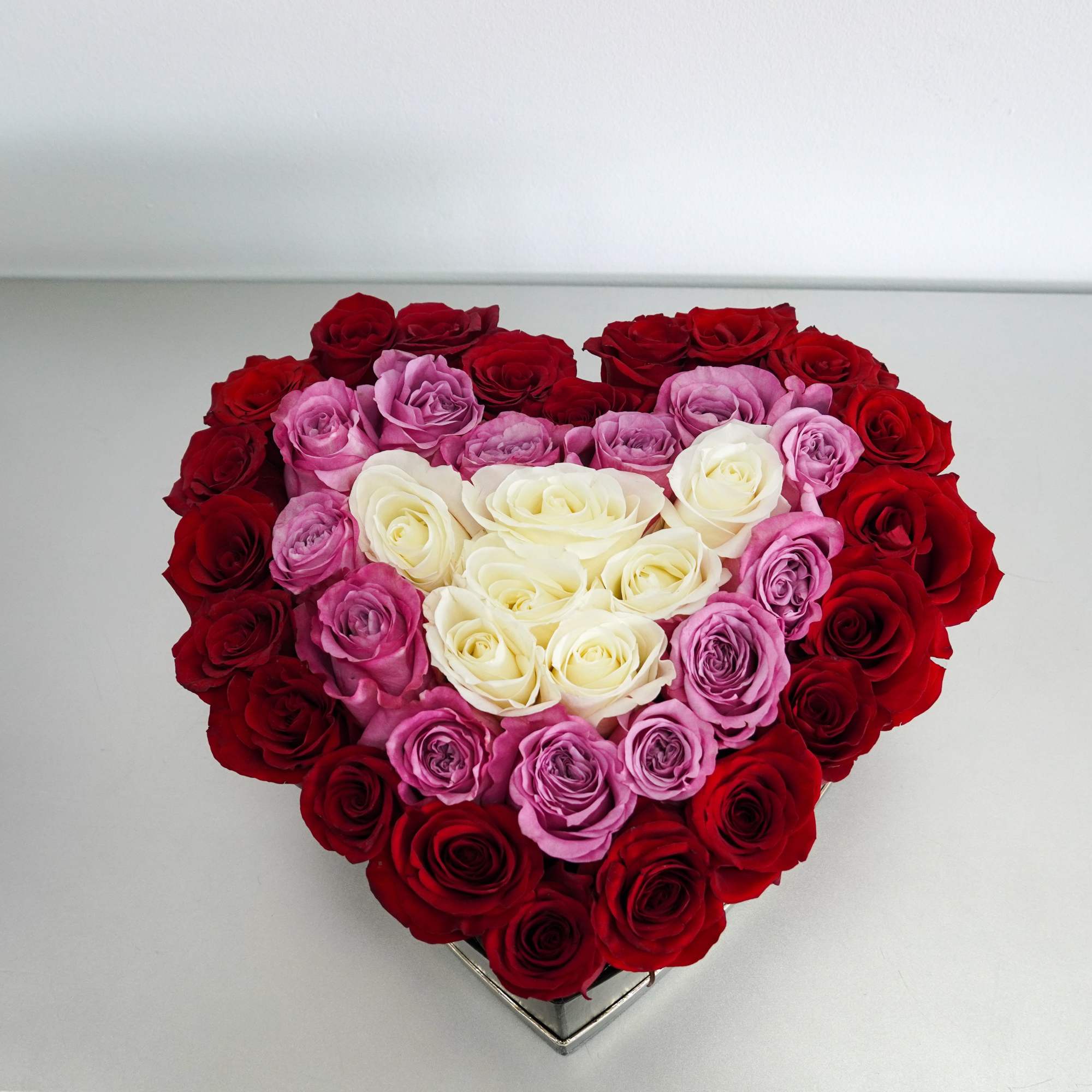 Heart-shaped box of red, pink, and white roses, photo 2 of 3