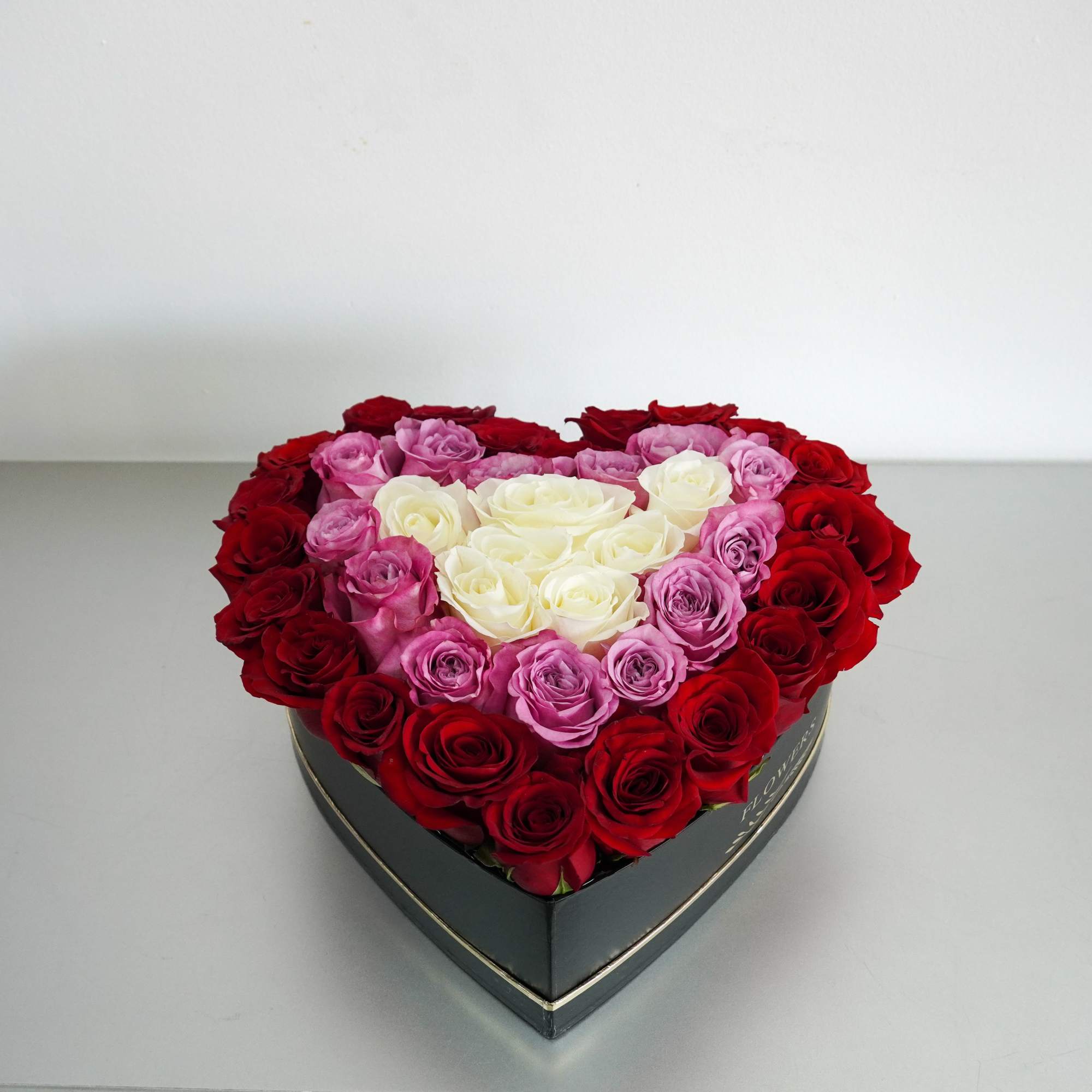 Heart-shaped box of red, pink, and white roses, photo 3 of 3