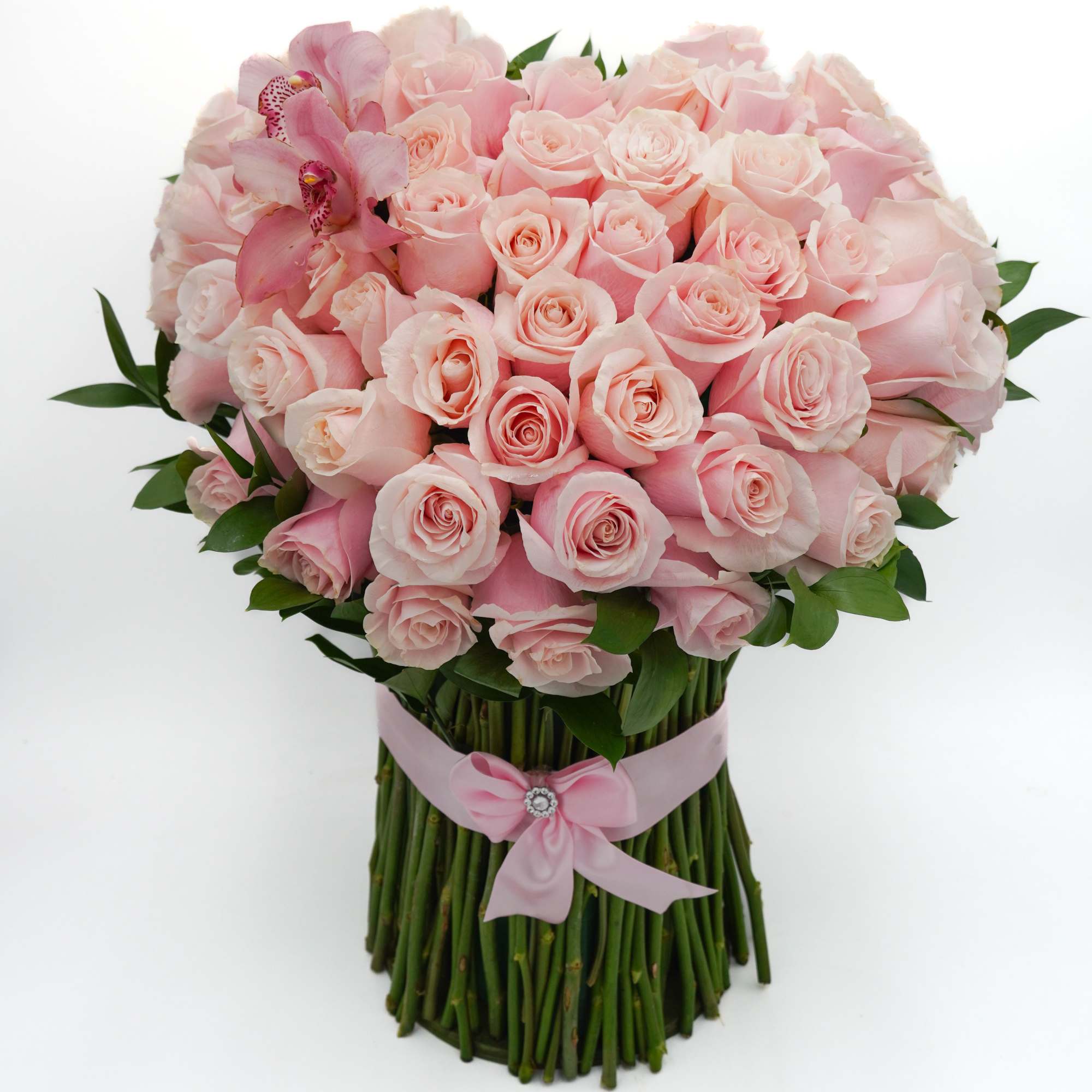 Bouquet of pale pink roses with a pink orchid accent and ribbon wrap