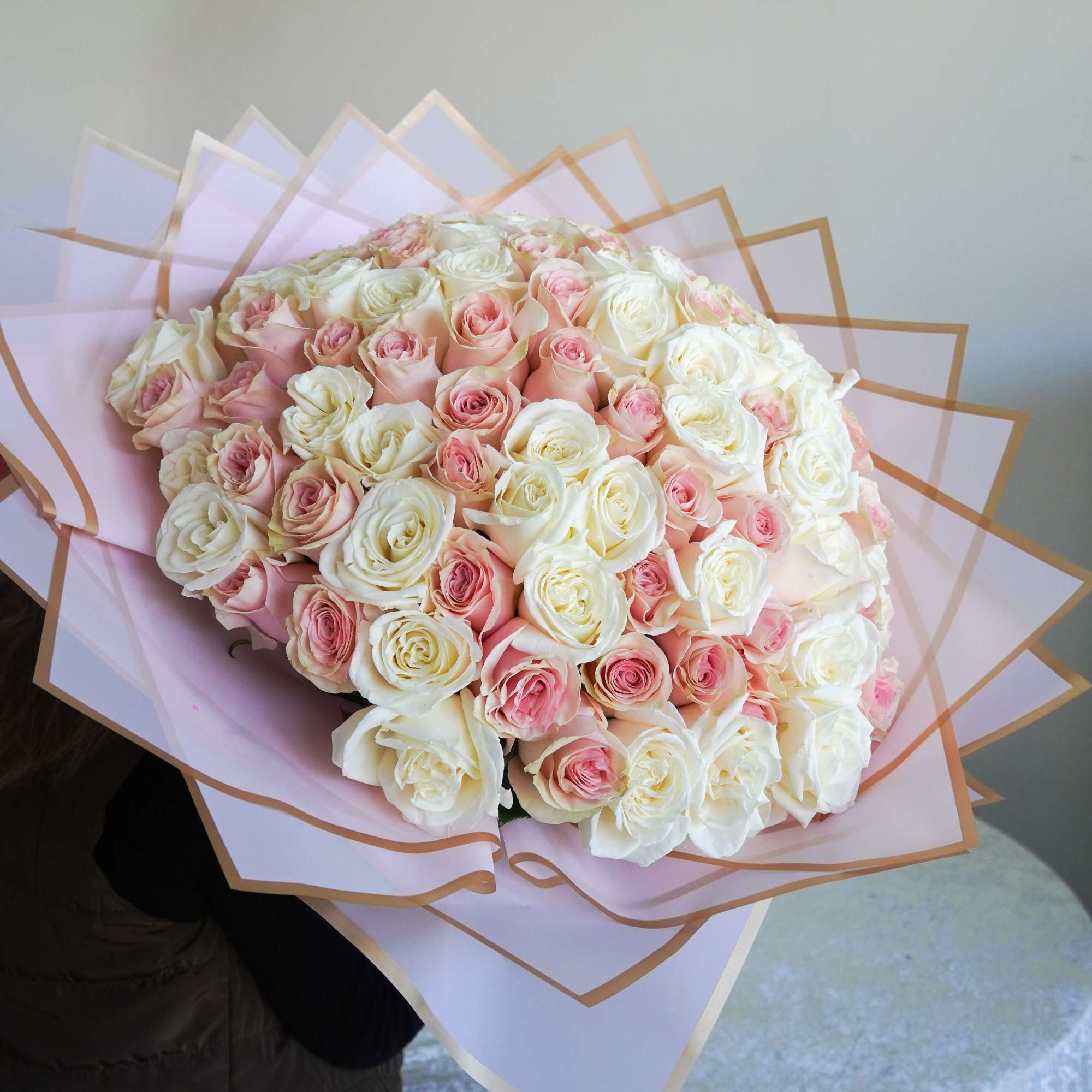 A luxurious bouquet of fresh blush pink and white roses, beautifully wrapped, photo 2 of 2