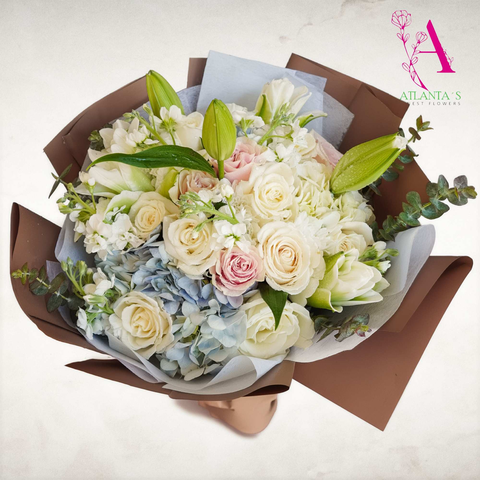 This dreamy bouquet features white blooms, blush roses, blue hydrangeas, and fresh, photo 2 of 2