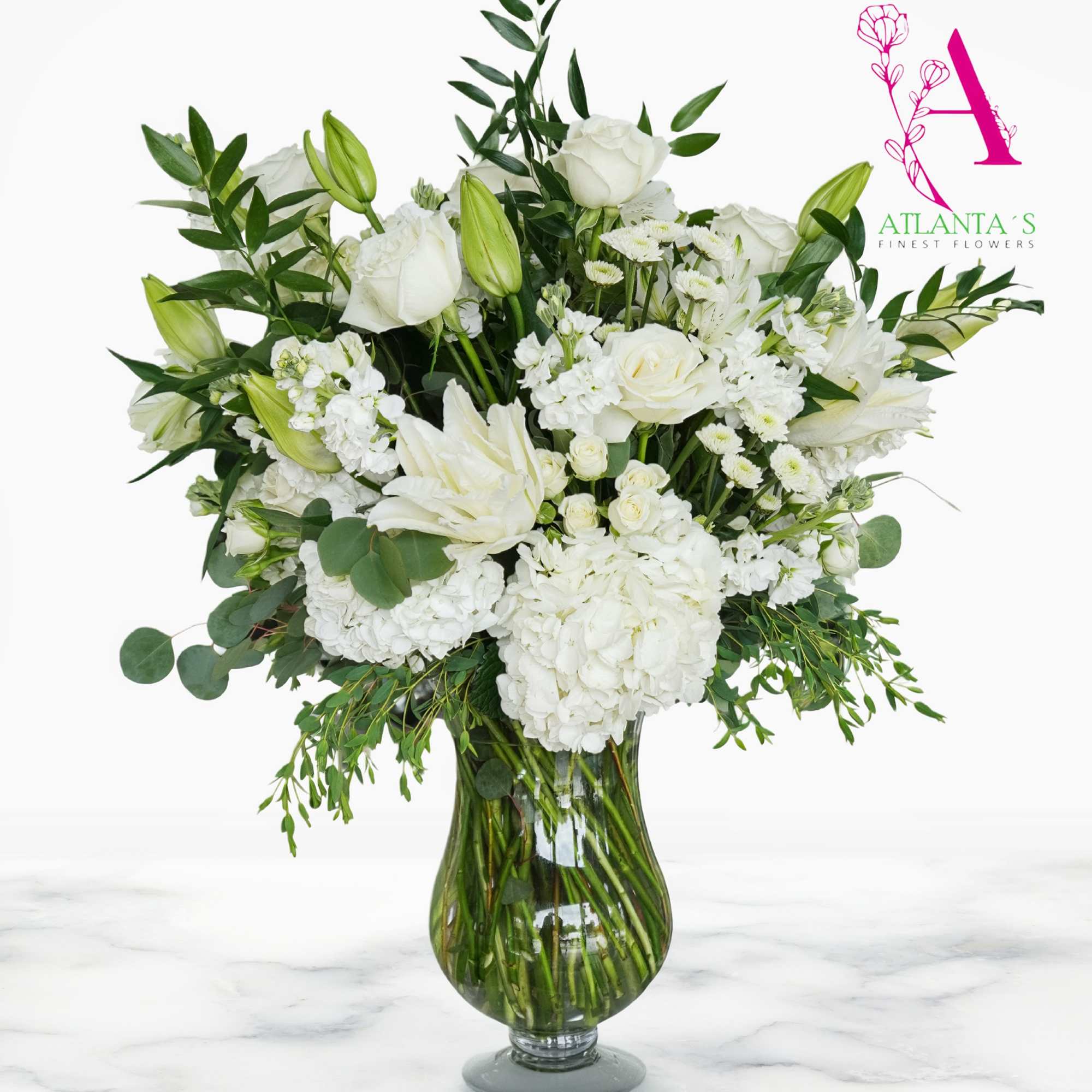 This Purest Love bouquet includes hydrangea, asiatic lilies, alstroemeria, miniature carnations, stock, photo 2 of 3