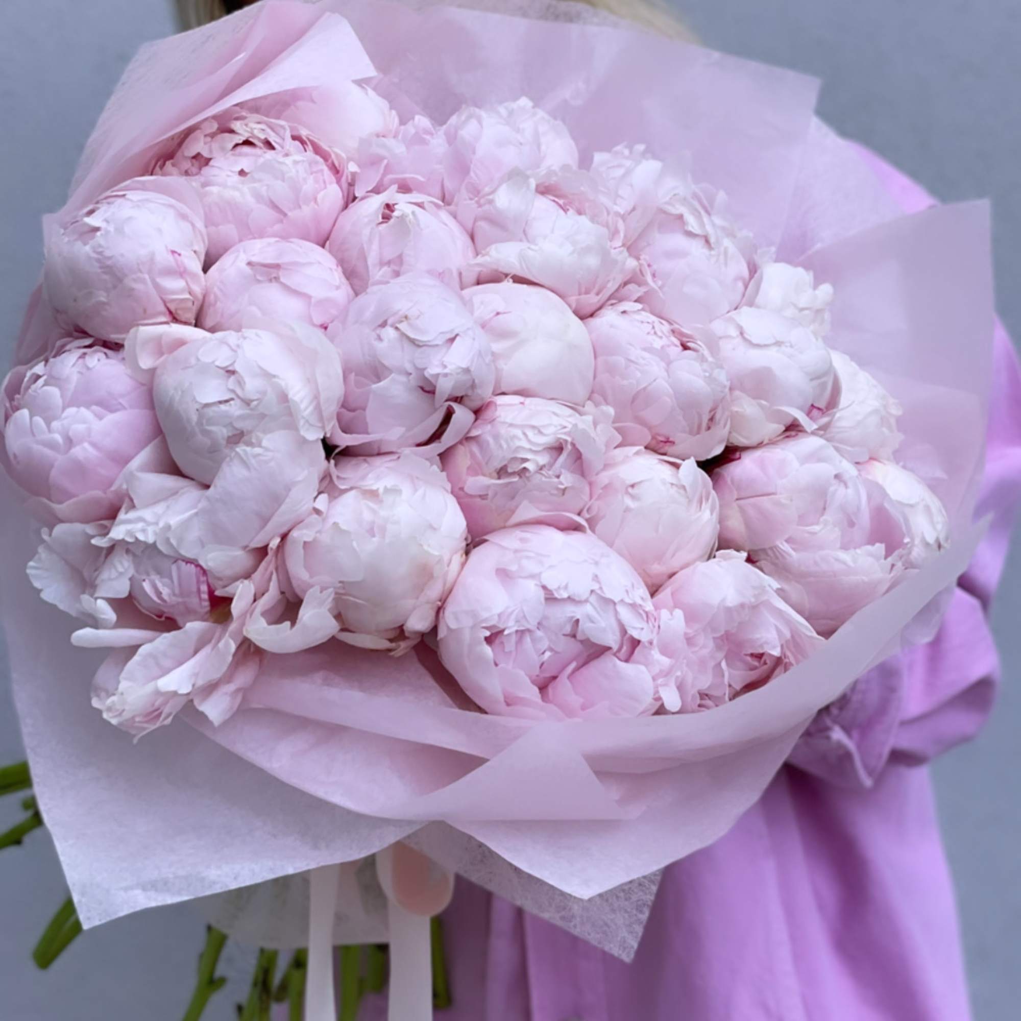 Large bouquet of pale pink peonies wrapped in pink paper, photo 10 of 10