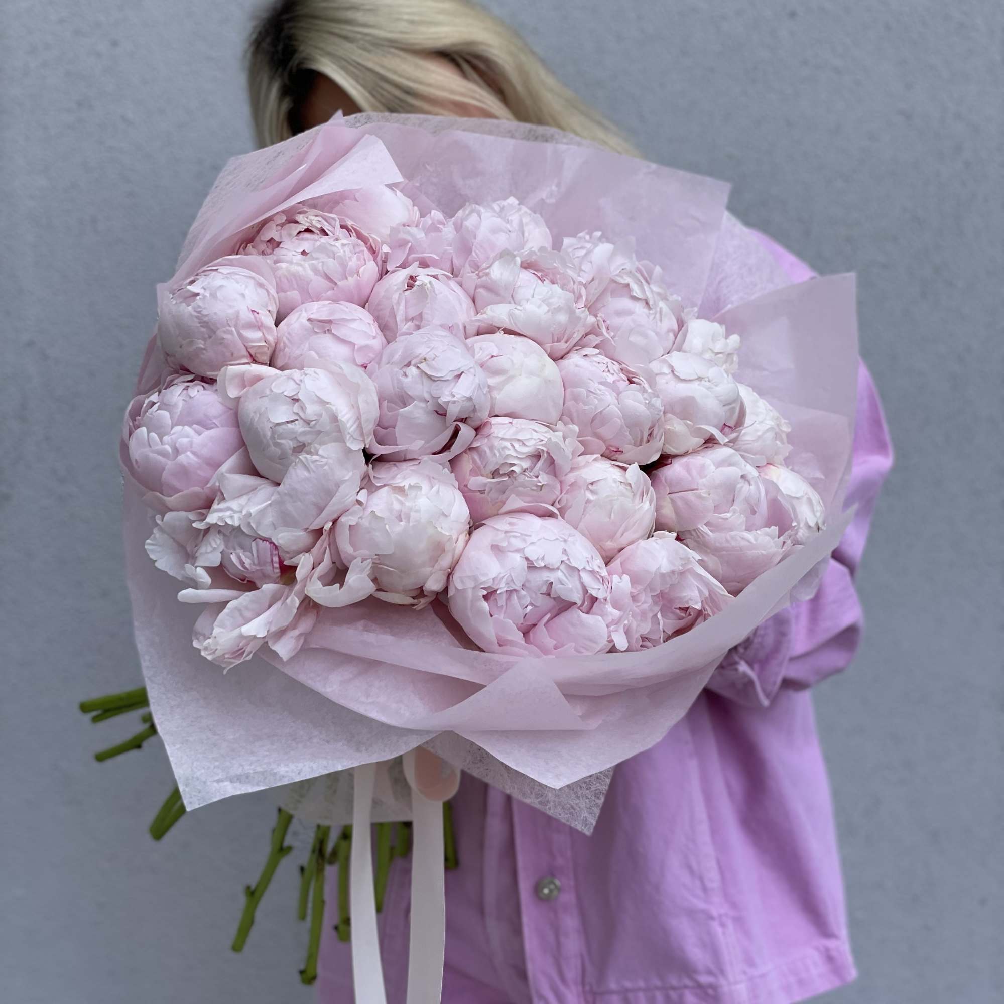 Large bouquet of pale pink peonies wrapped in pink paper, photo 5 of 10