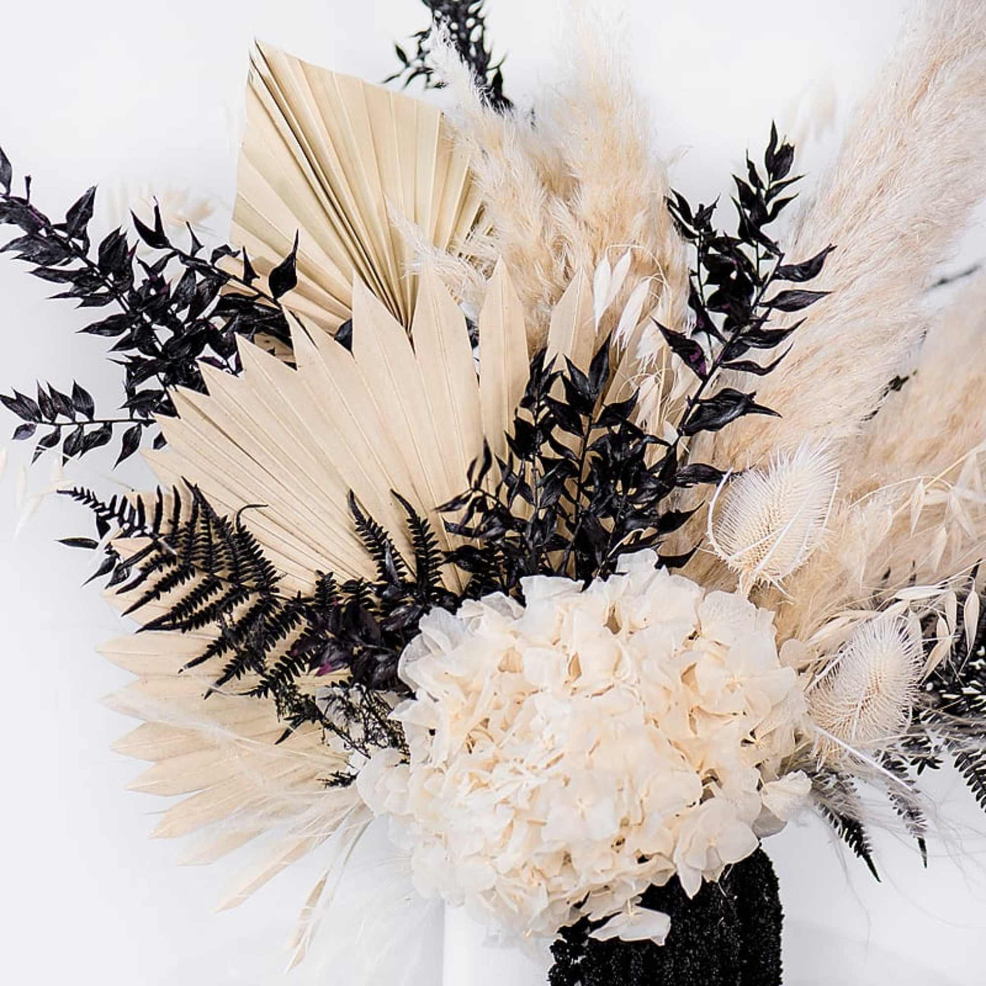 Cream dried floral arrangement with black foliage and pampas grass