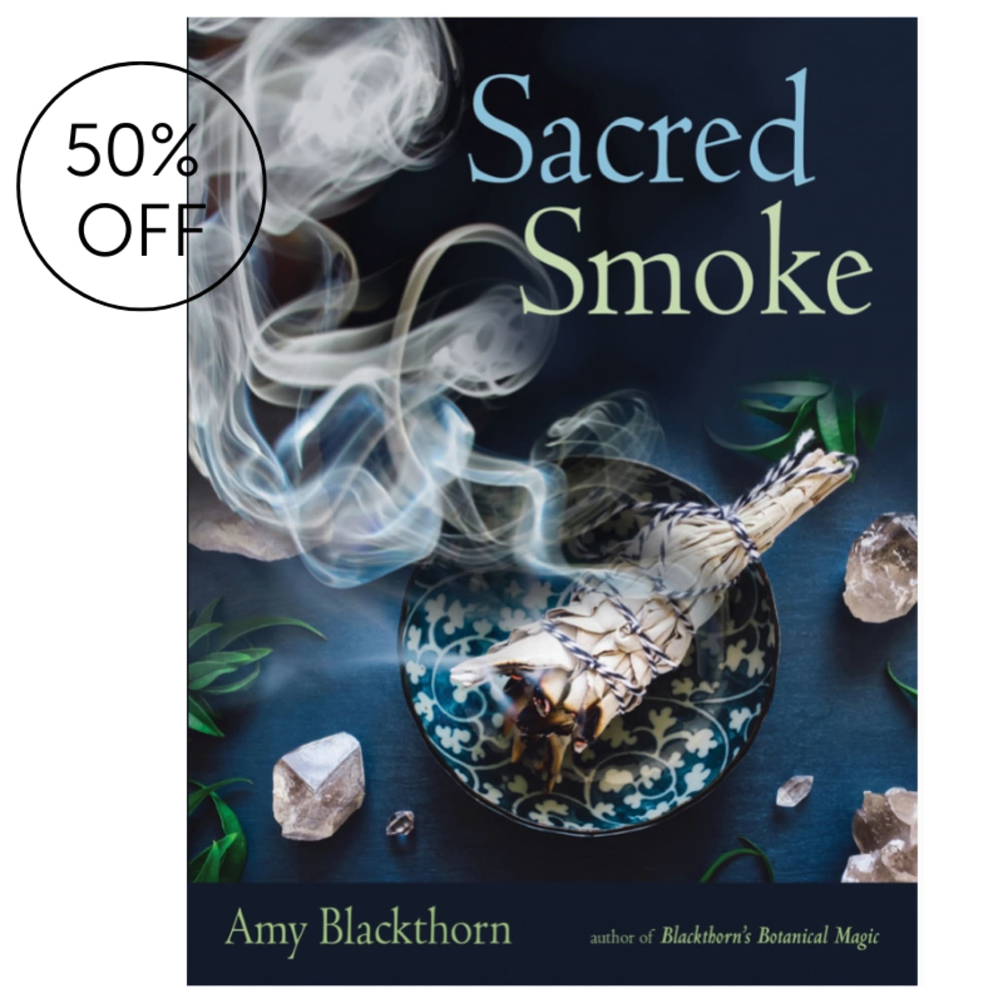 Book cover with smoke, a sage bundle, and crystals