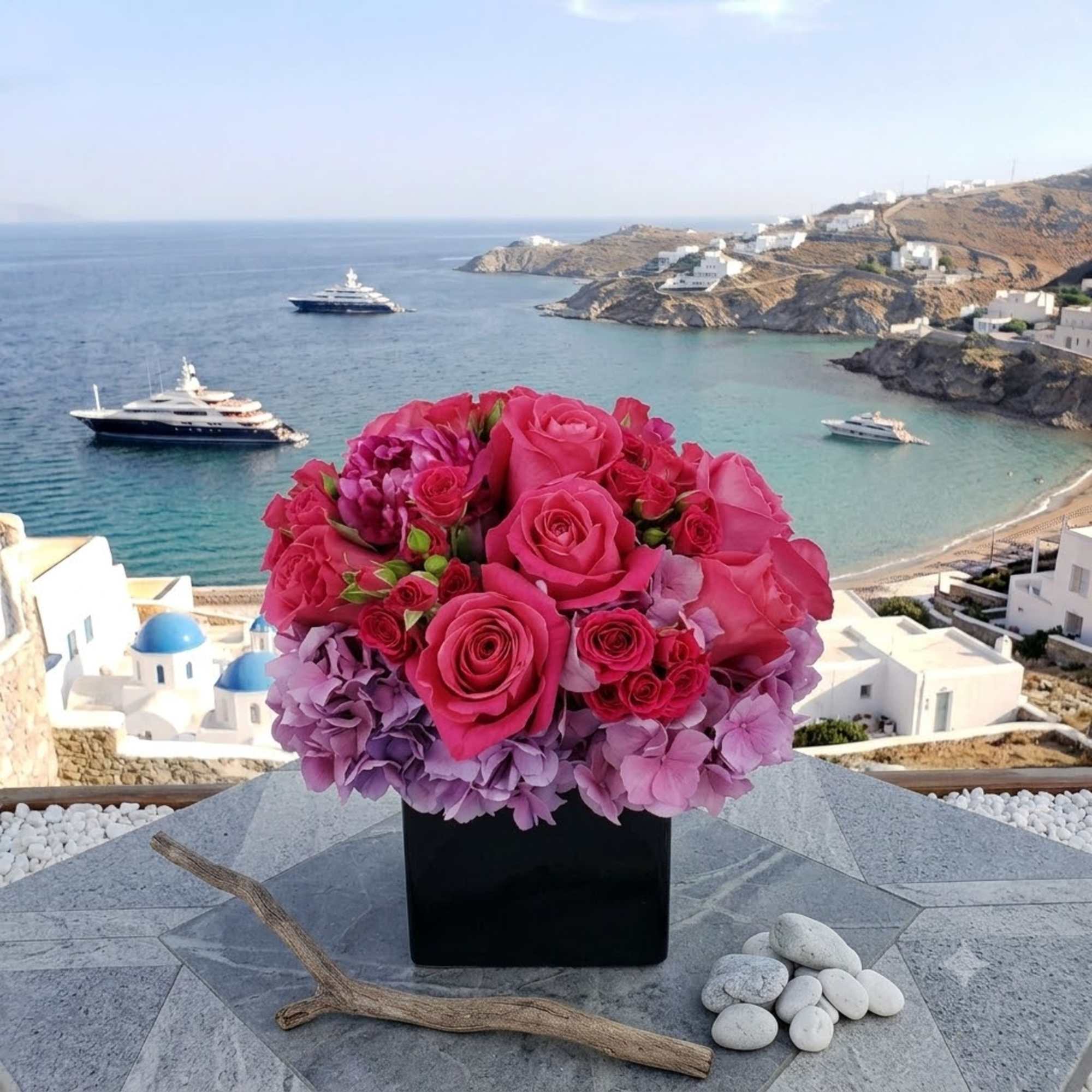 Pink rose and hydrangea arrangement in a black square vase