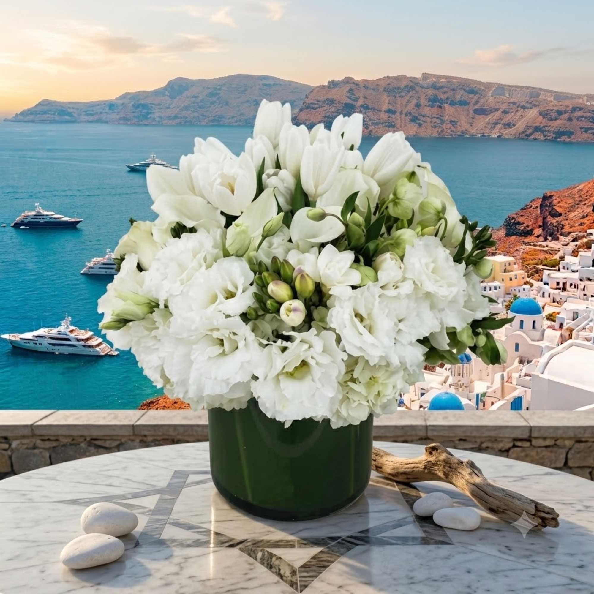 White floral arrangement in a dark green vase on a marble table