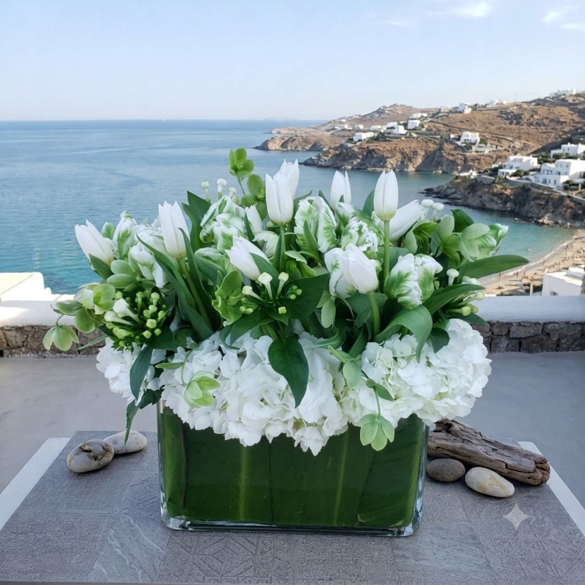White tulips and hydrangeas arranged in a glass vase, photo 2 of 4