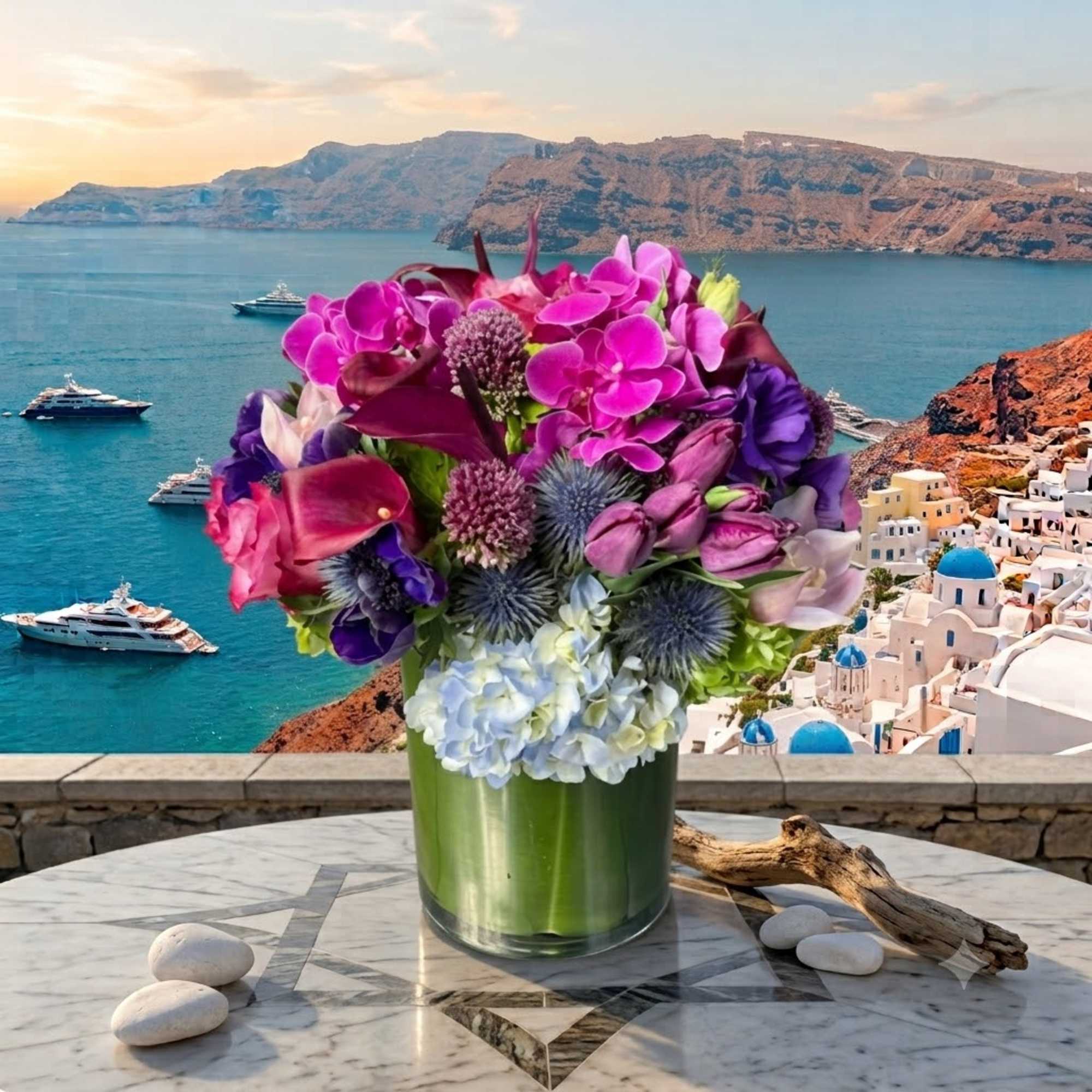 Bright mixed bouquet in a green glass vase on a marble table