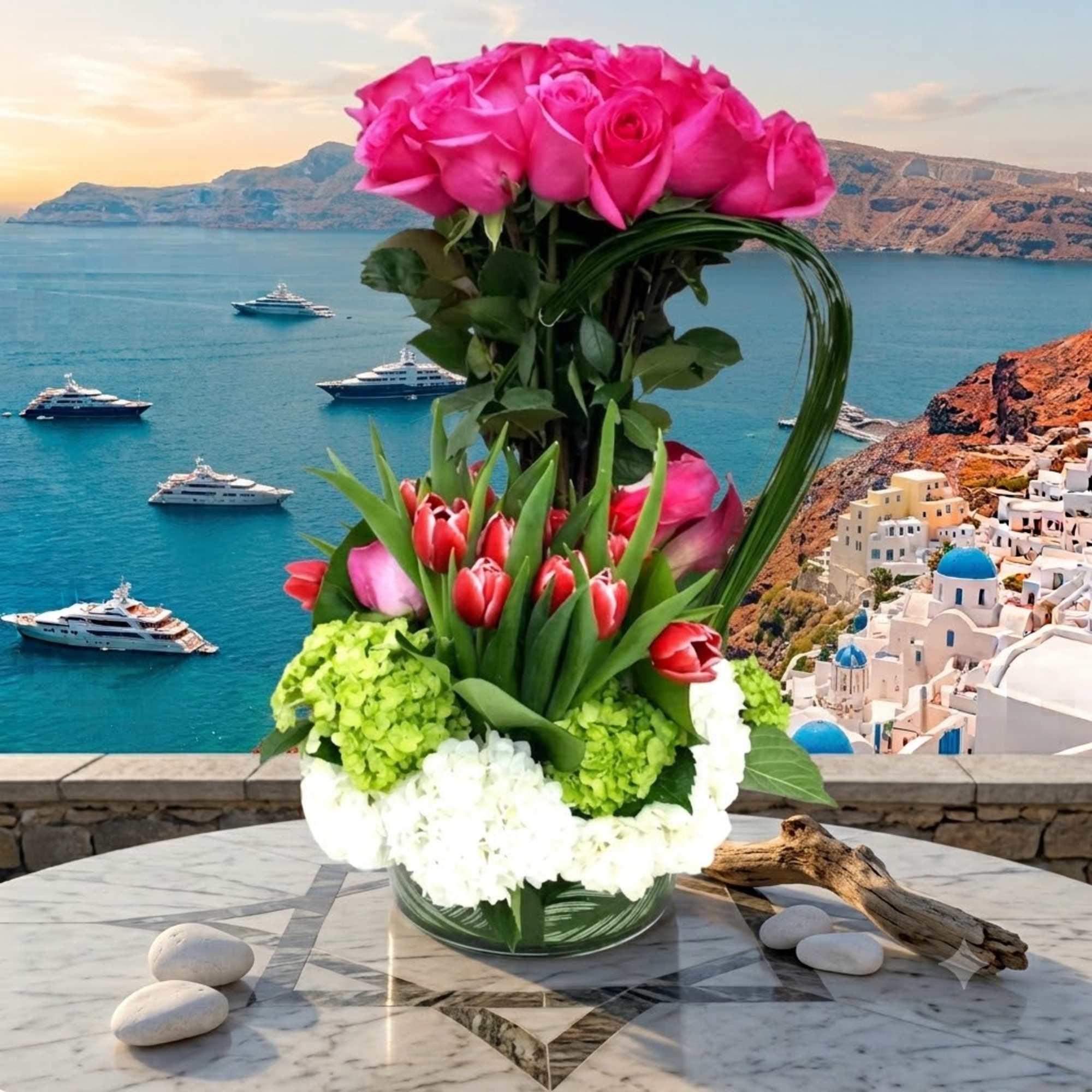 Tall bouquet of pink roses and red tulips in a glass vase