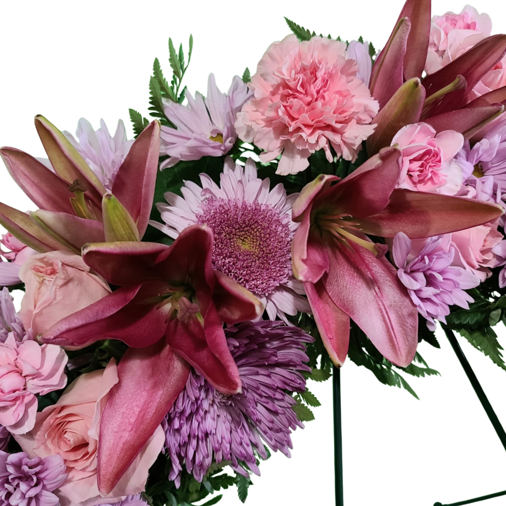 Pink and purple bouquet with lilies, roses, carnations, and daisies