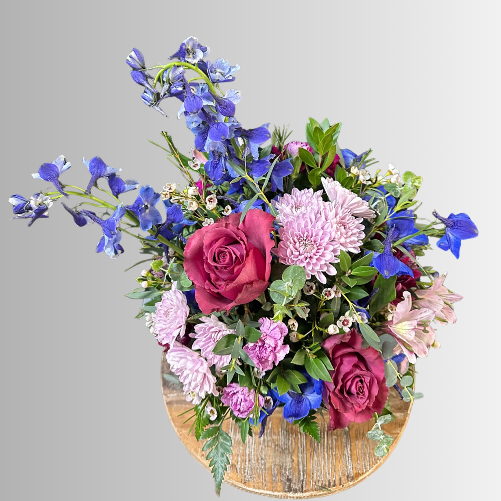 This fun bouquet combines purple and blue flowers for a sweet gift, photo 2 of 2