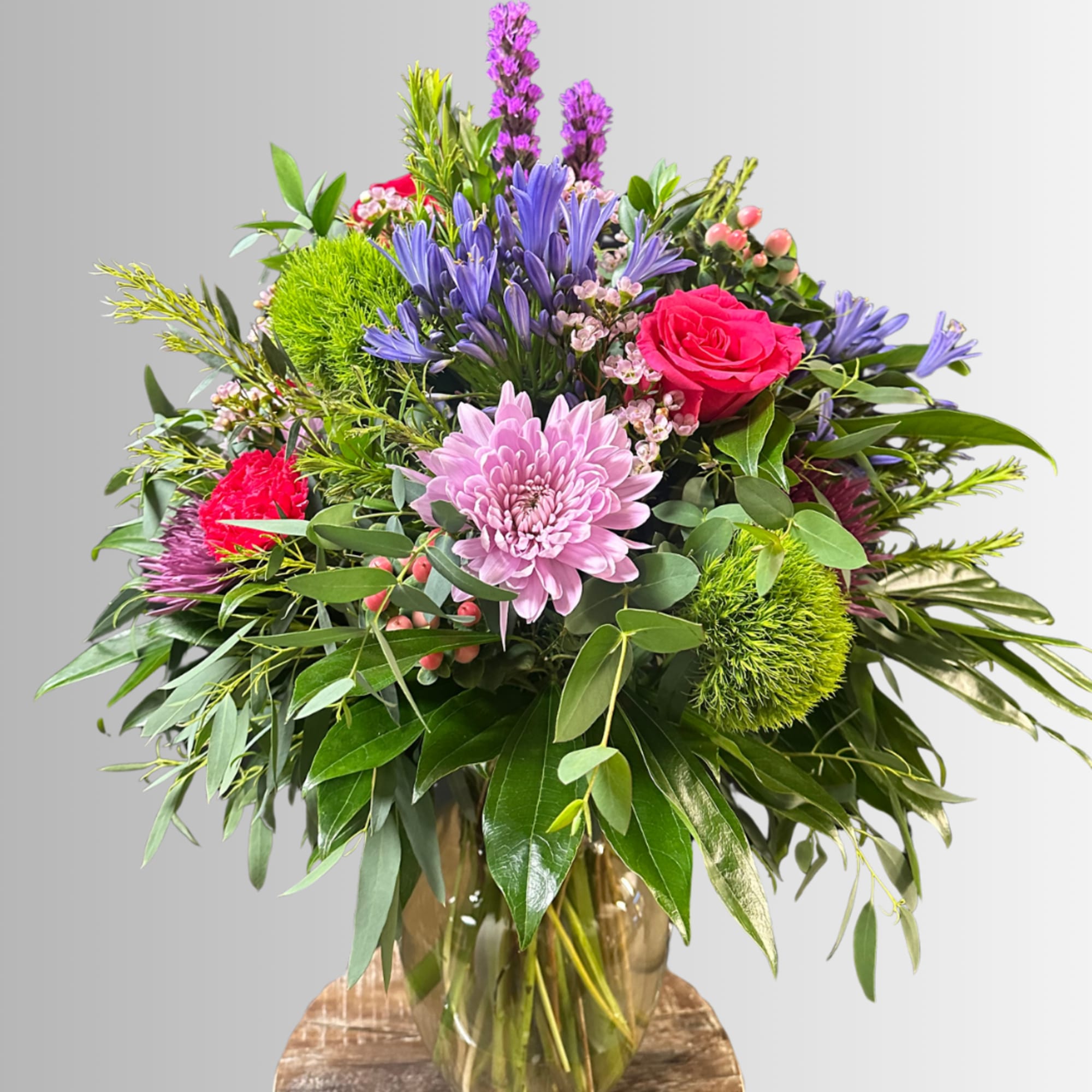 Large garden-style bouquet packed full of fun flowers in hues of pink