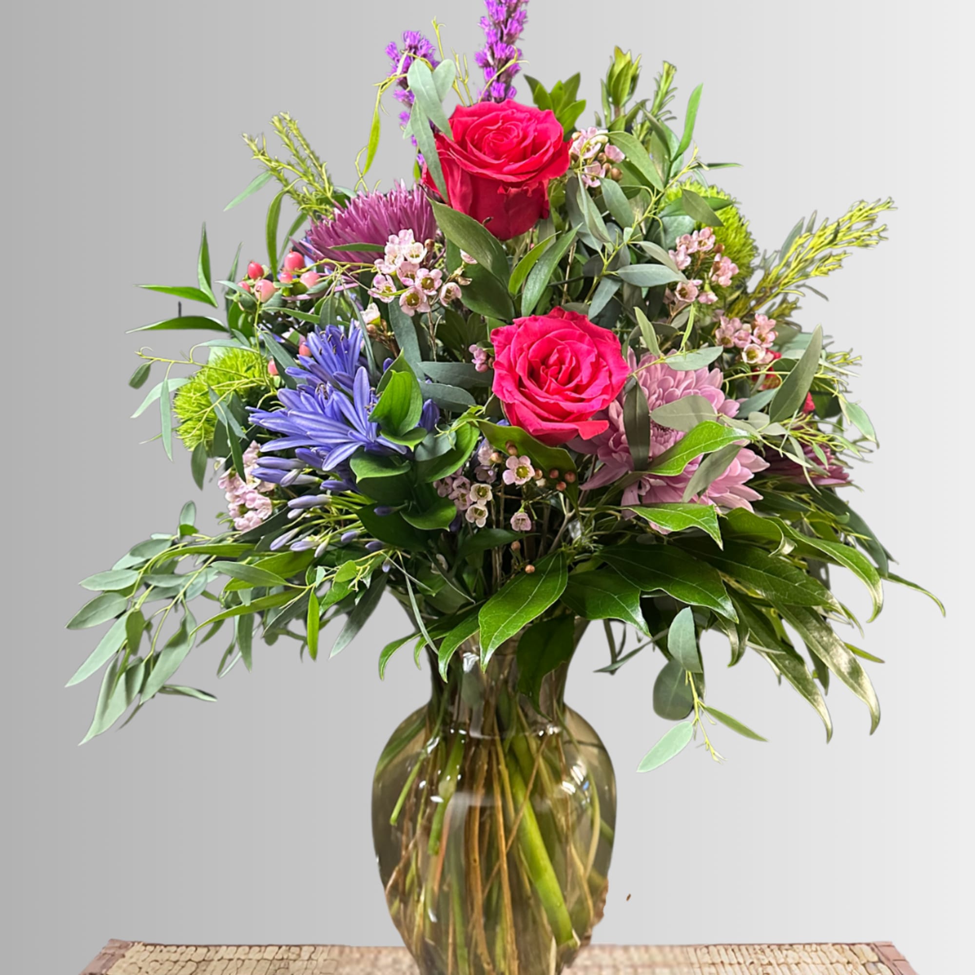 Large garden-style bouquet packed full of fun flowers in hues of pink, photo 2 of 2
