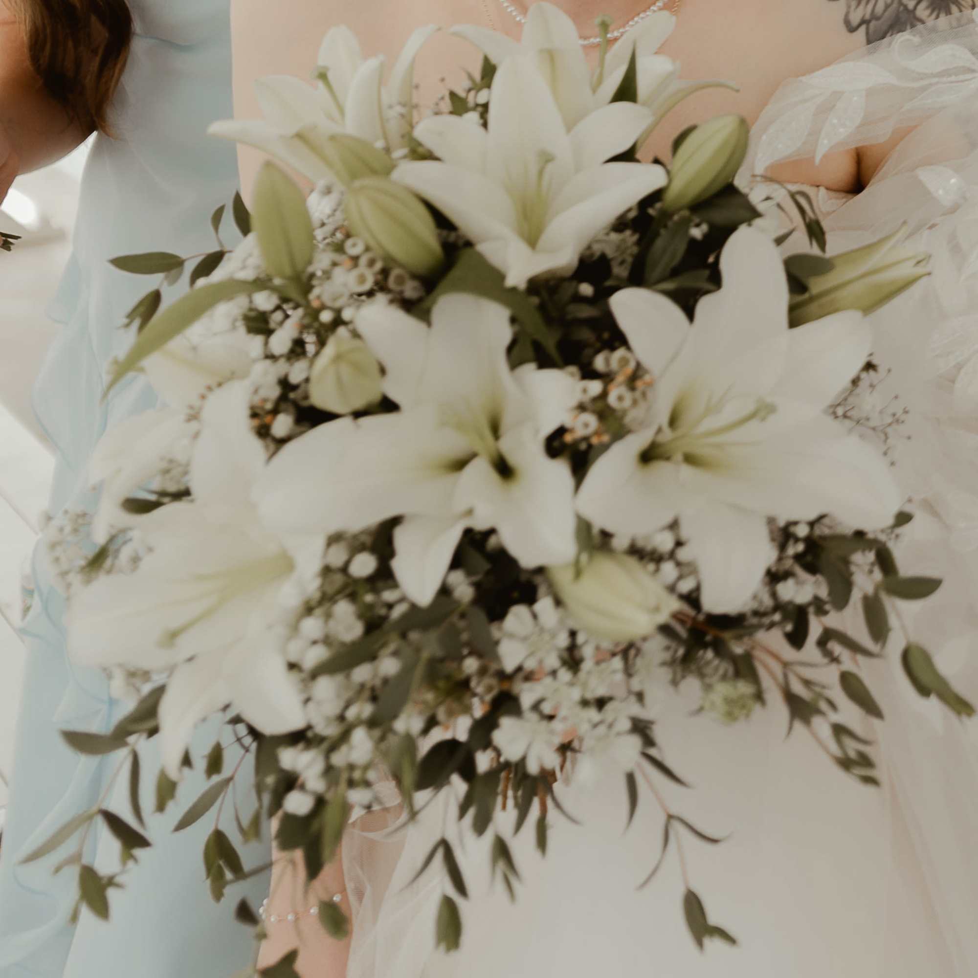 Simple and elegant bouquet of lilies, waxflower, and baby's breath , photo 3 of 3